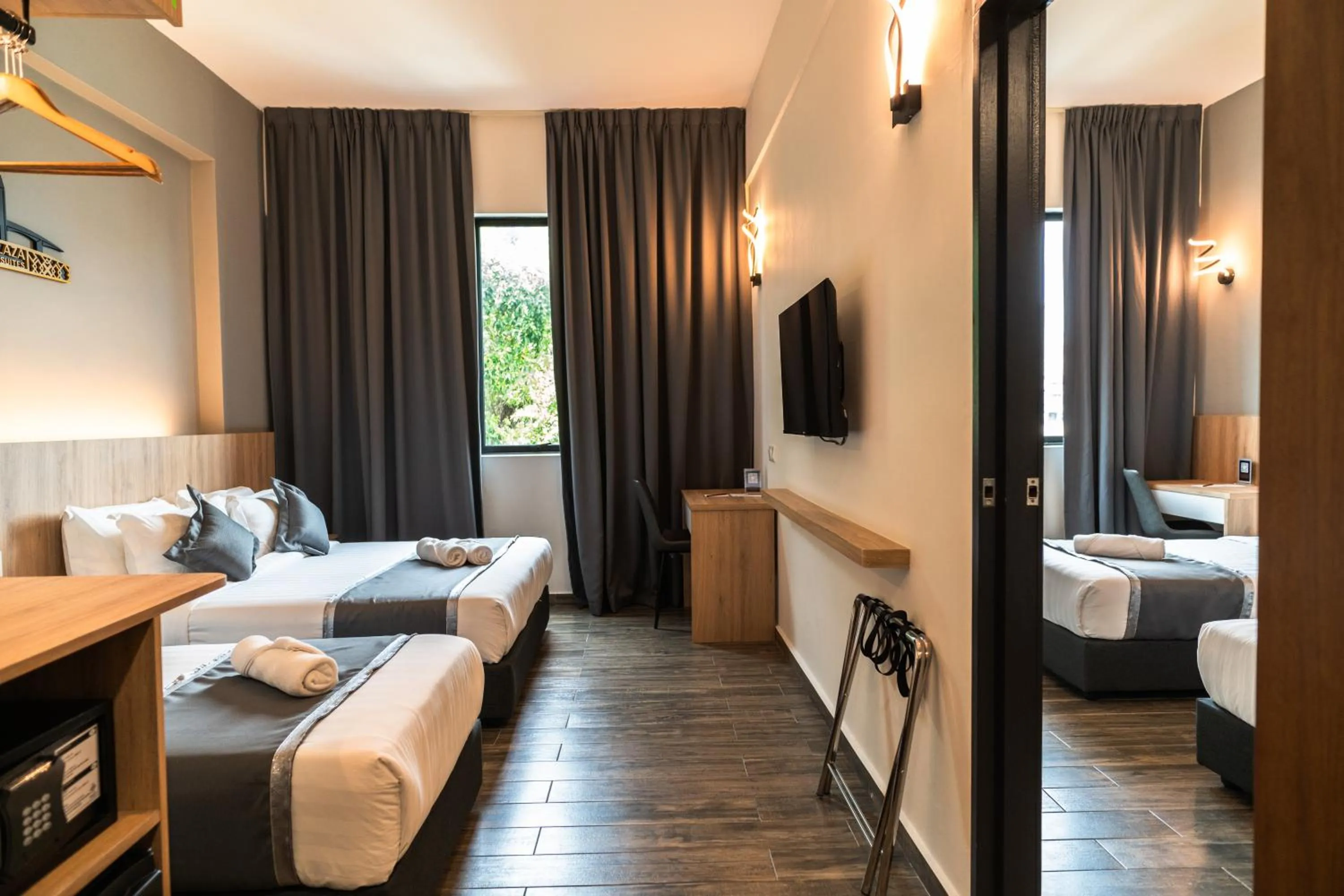 Bed in DJ Citi Plaza Hotel & Suites