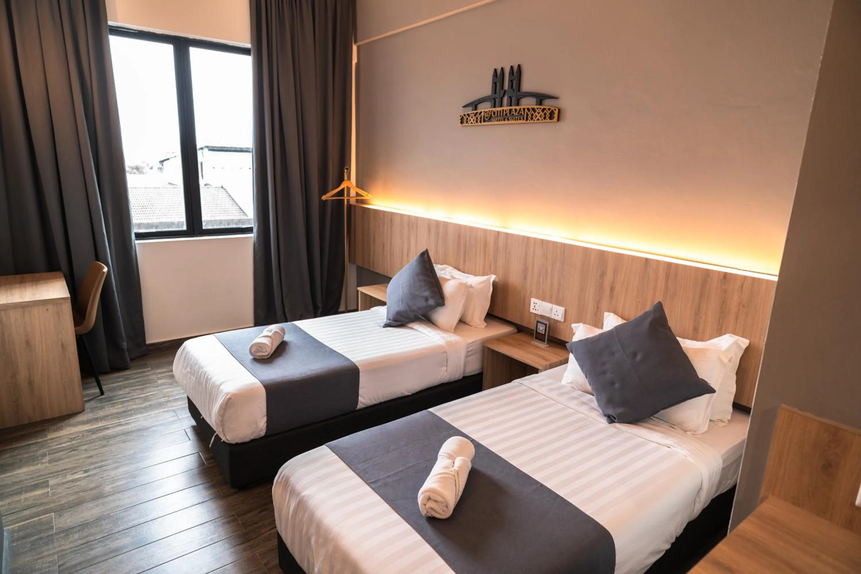 Bed in DJ Citi Plaza Hotel & Suites