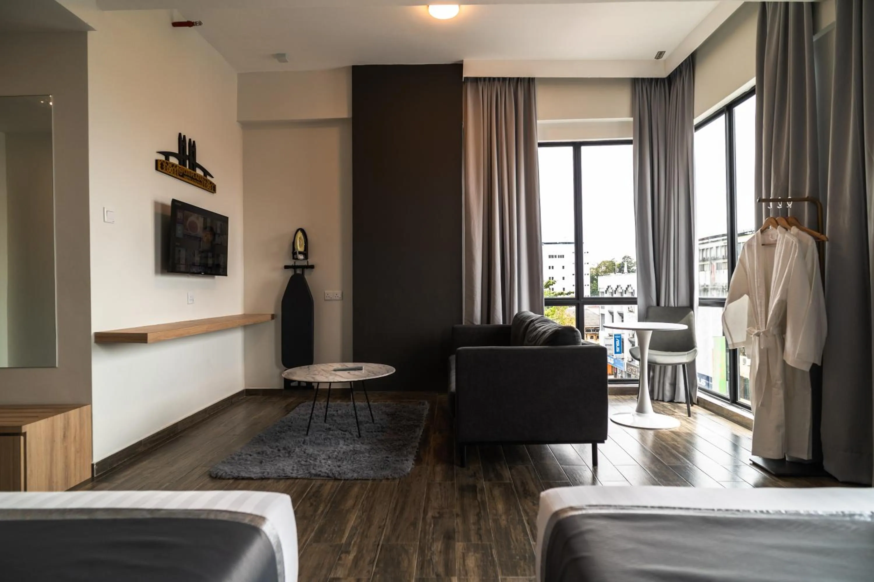 Bed in DJ Citi Plaza Hotel & Suites