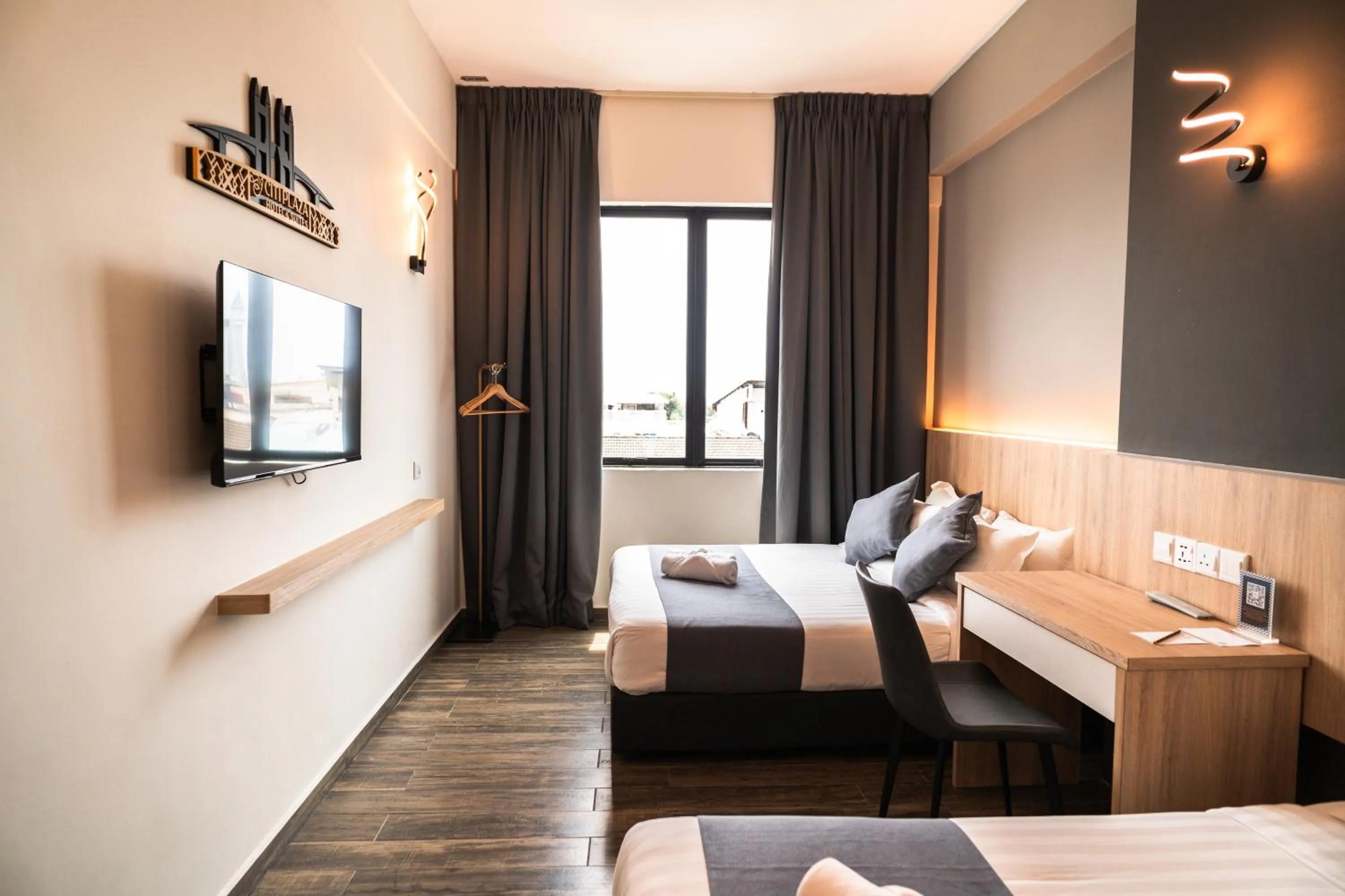 Bed in DJ Citi Plaza Hotel & Suites