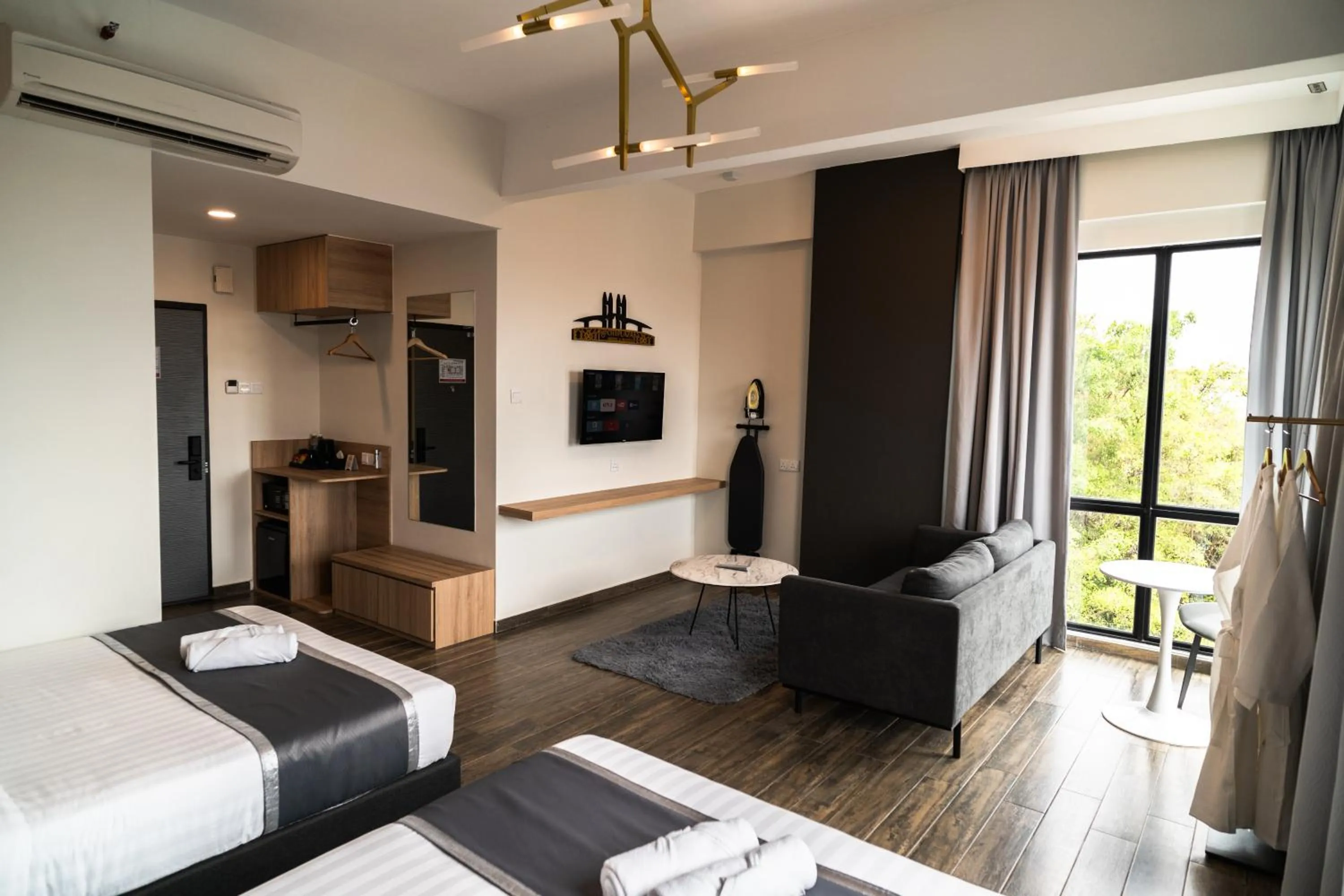 Bed in DJ Citi Plaza Hotel & Suites