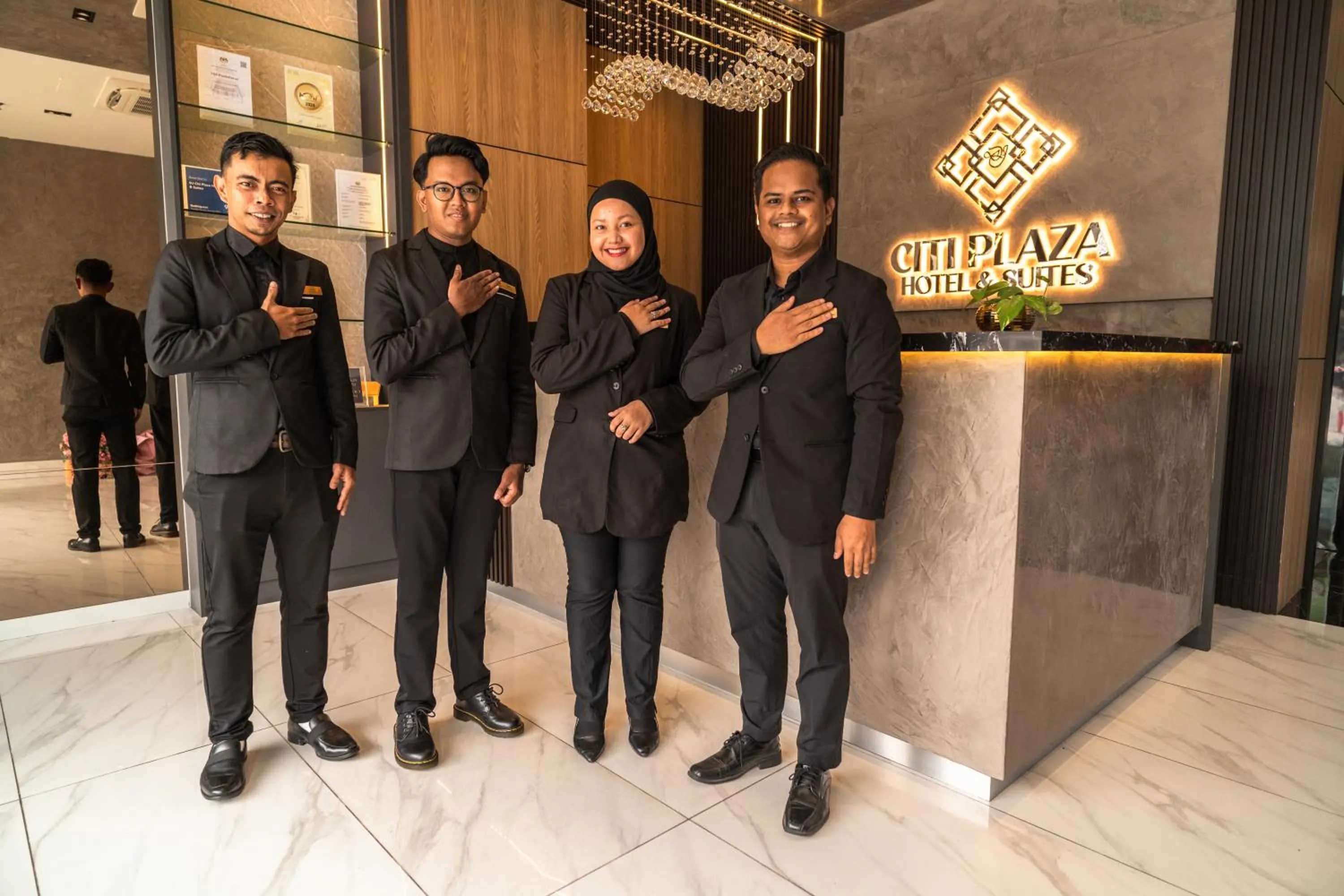 Staff in DJ Citi Plaza Hotel & Suites