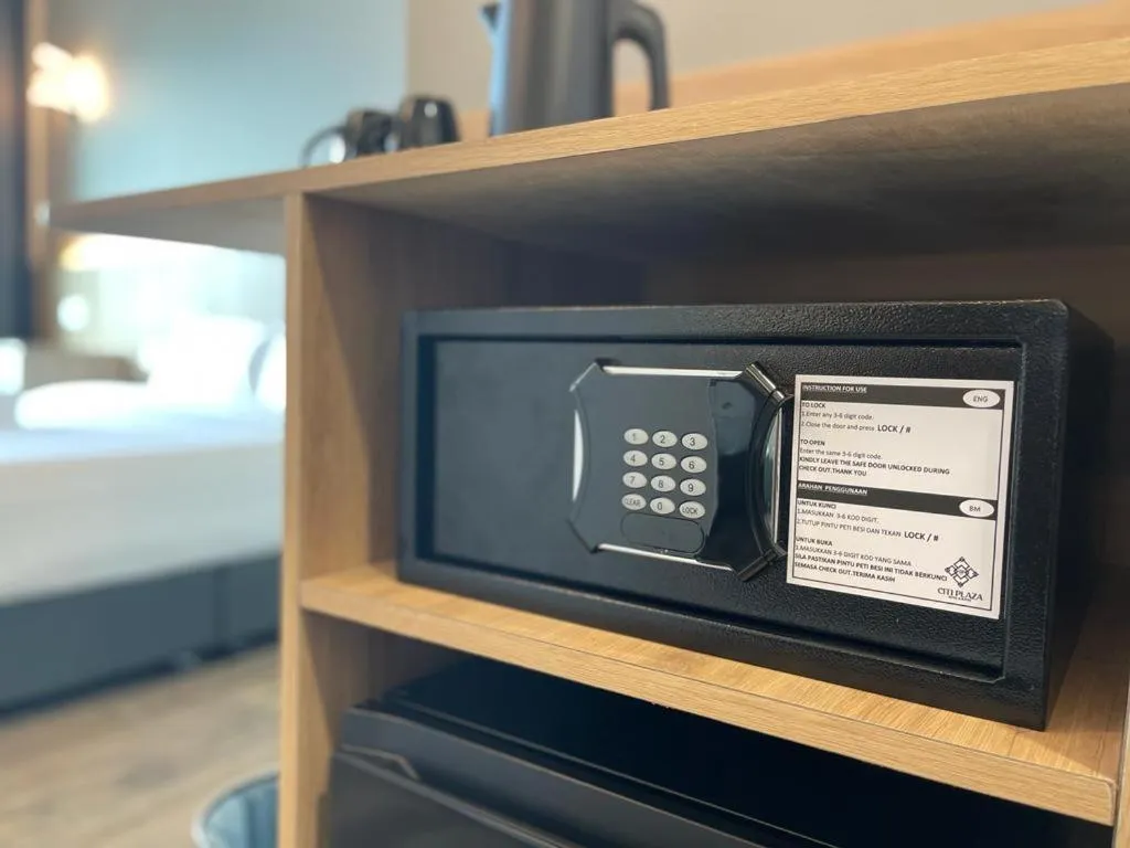 Bed in DJ Citi Plaza Hotel & Suites