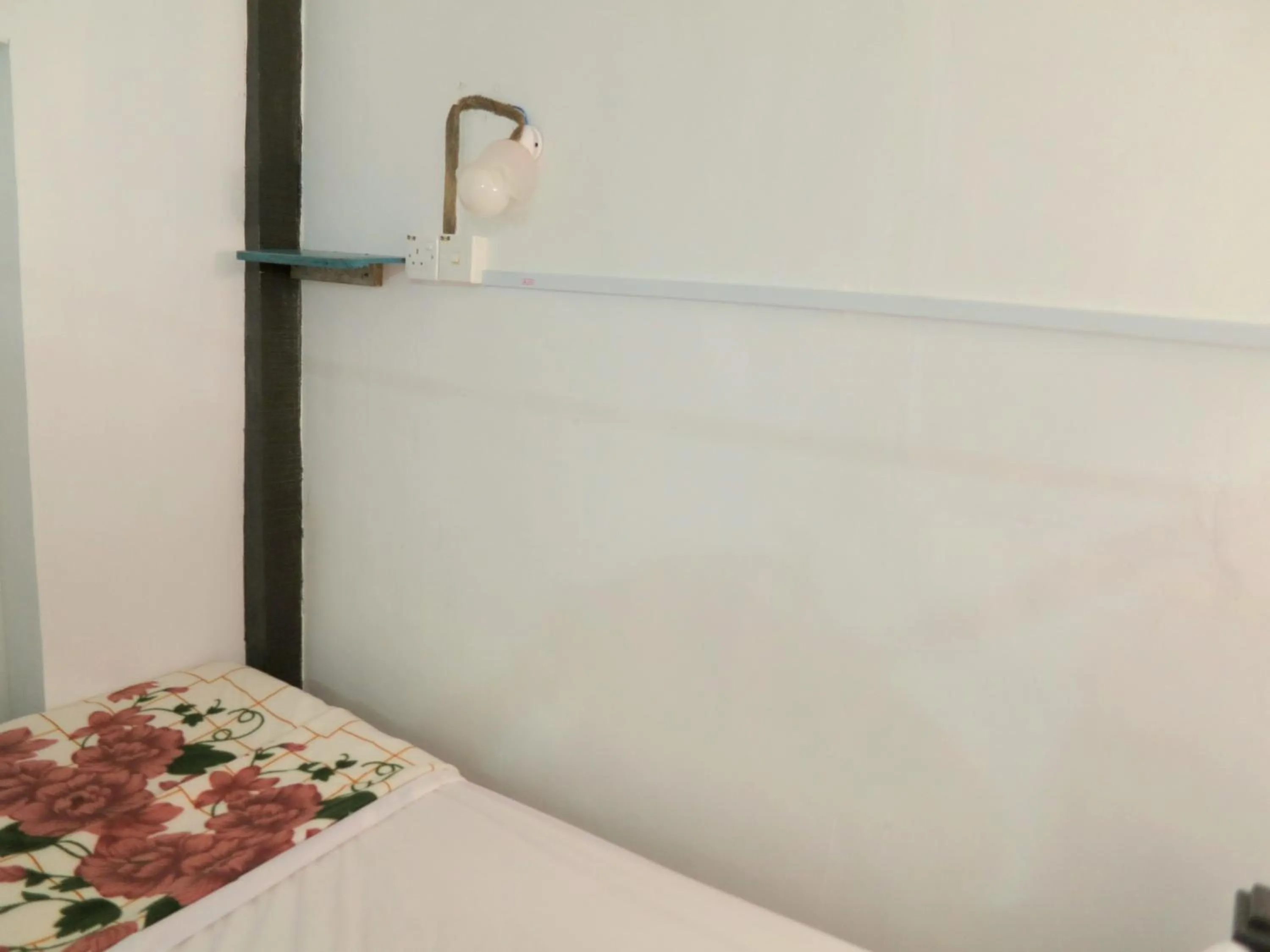 Bed in Pangkor Guesthouse SPK