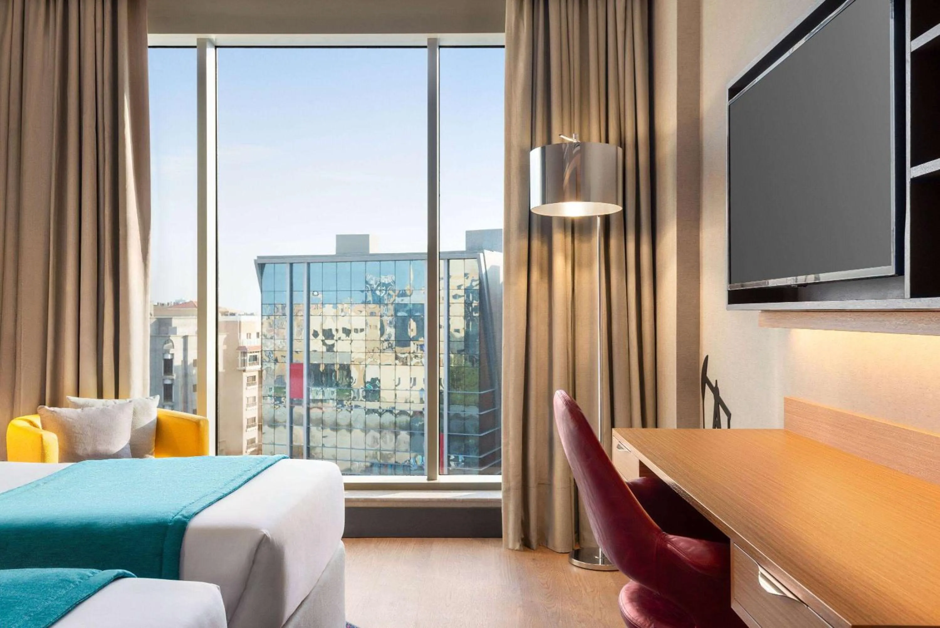 Photo of the whole room, Bed in Ramada Encore Al Khobar Corniche