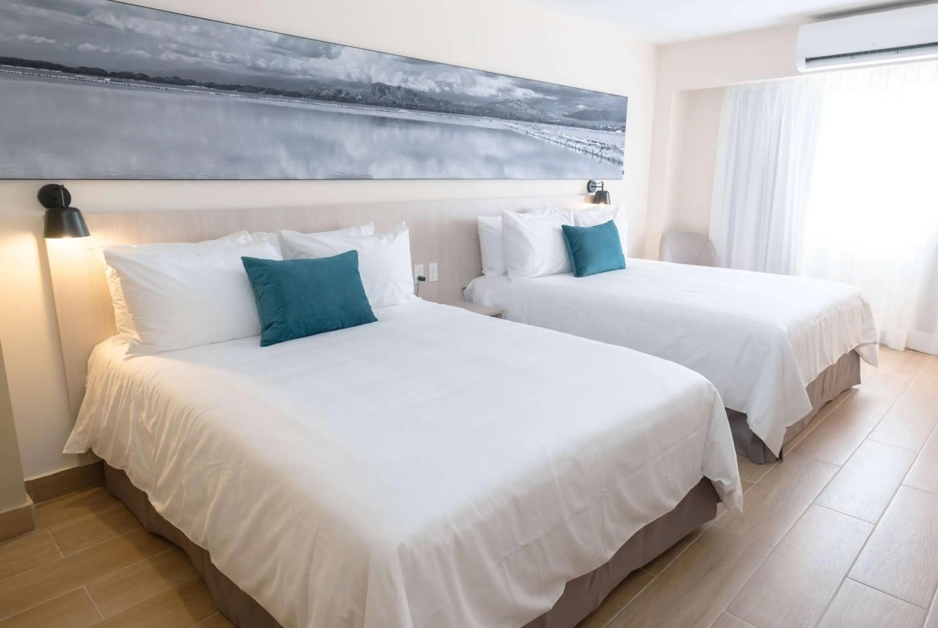 Photo of the whole room, Bed in Wyndham Garden El Morro Montecristi