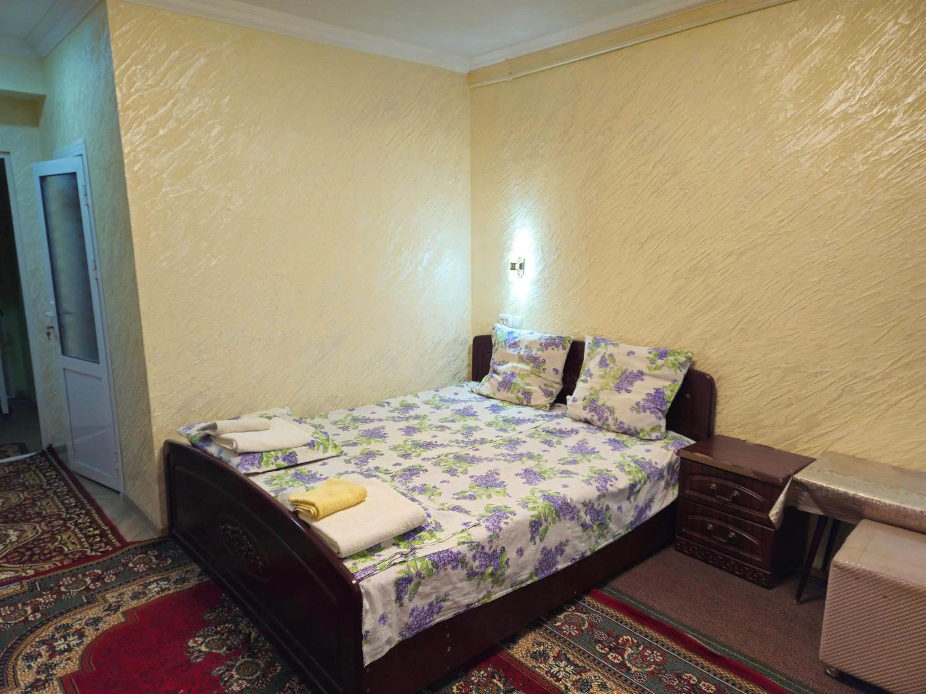 Bed in B&B Bahodir