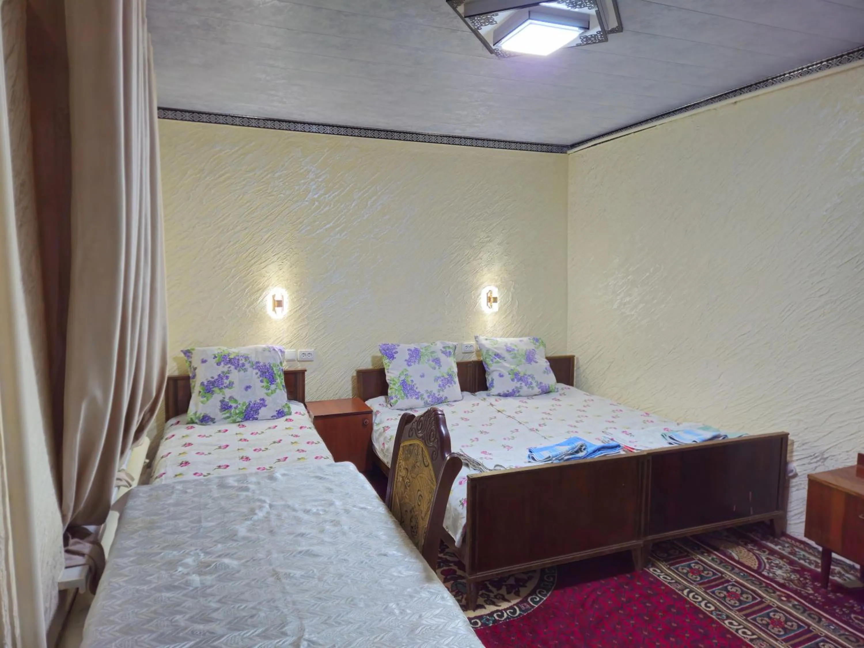Bed in B&B Bahodir