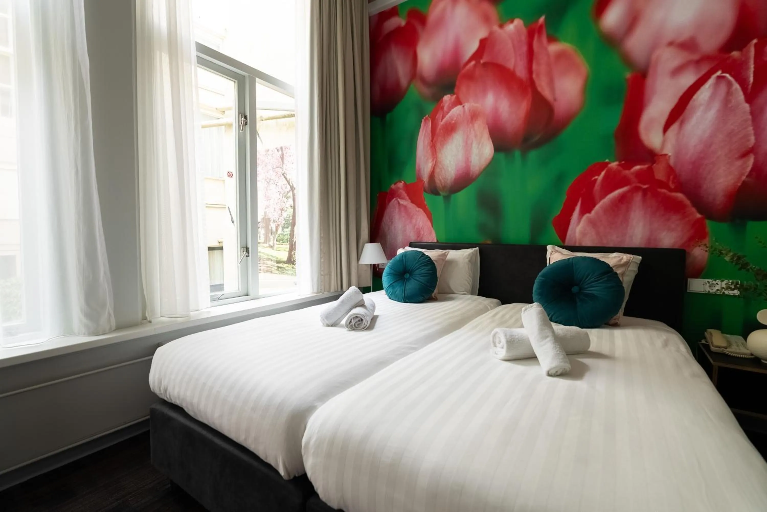 Bed in Multatuli Hotel