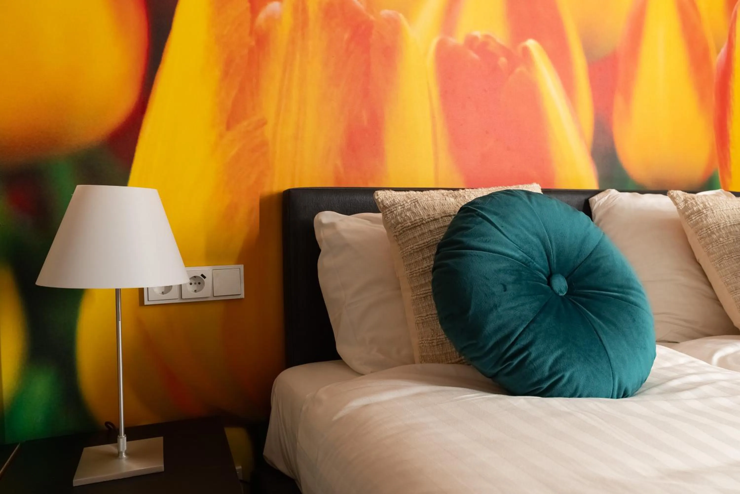 Bed in Multatuli Hotel