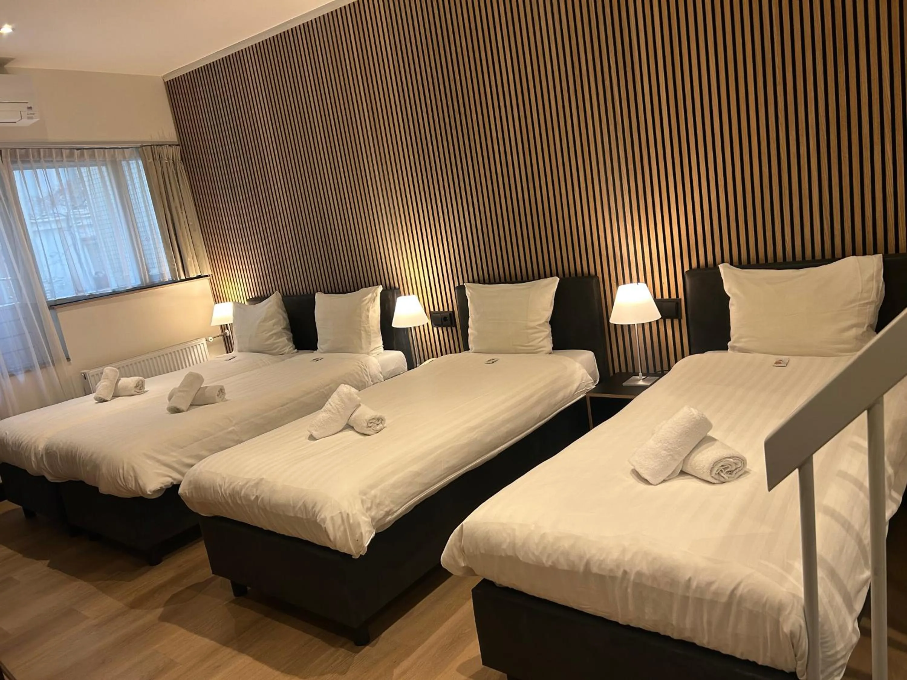 Bed in Multatuli Hotel