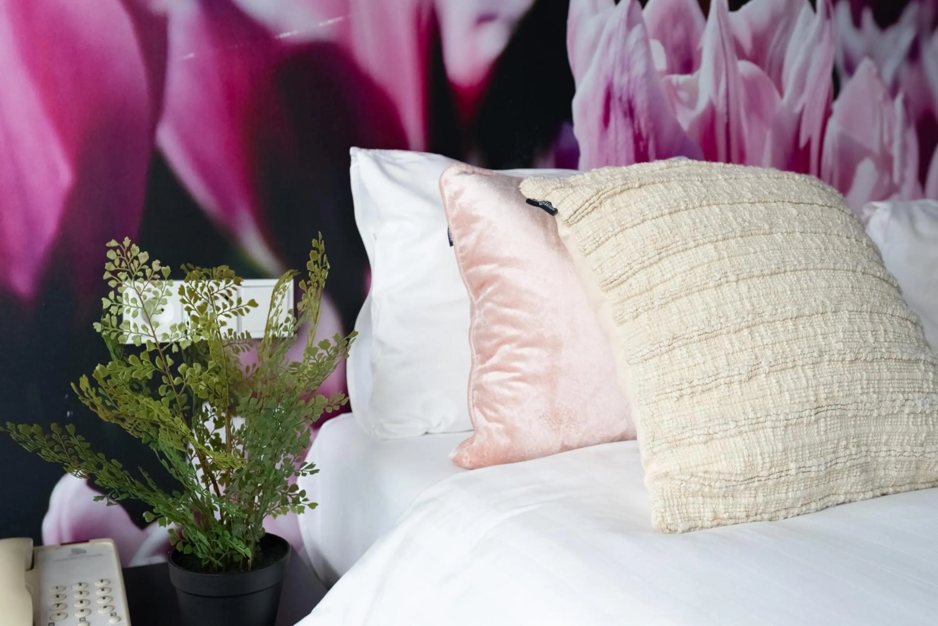 Bed in Multatuli Hotel