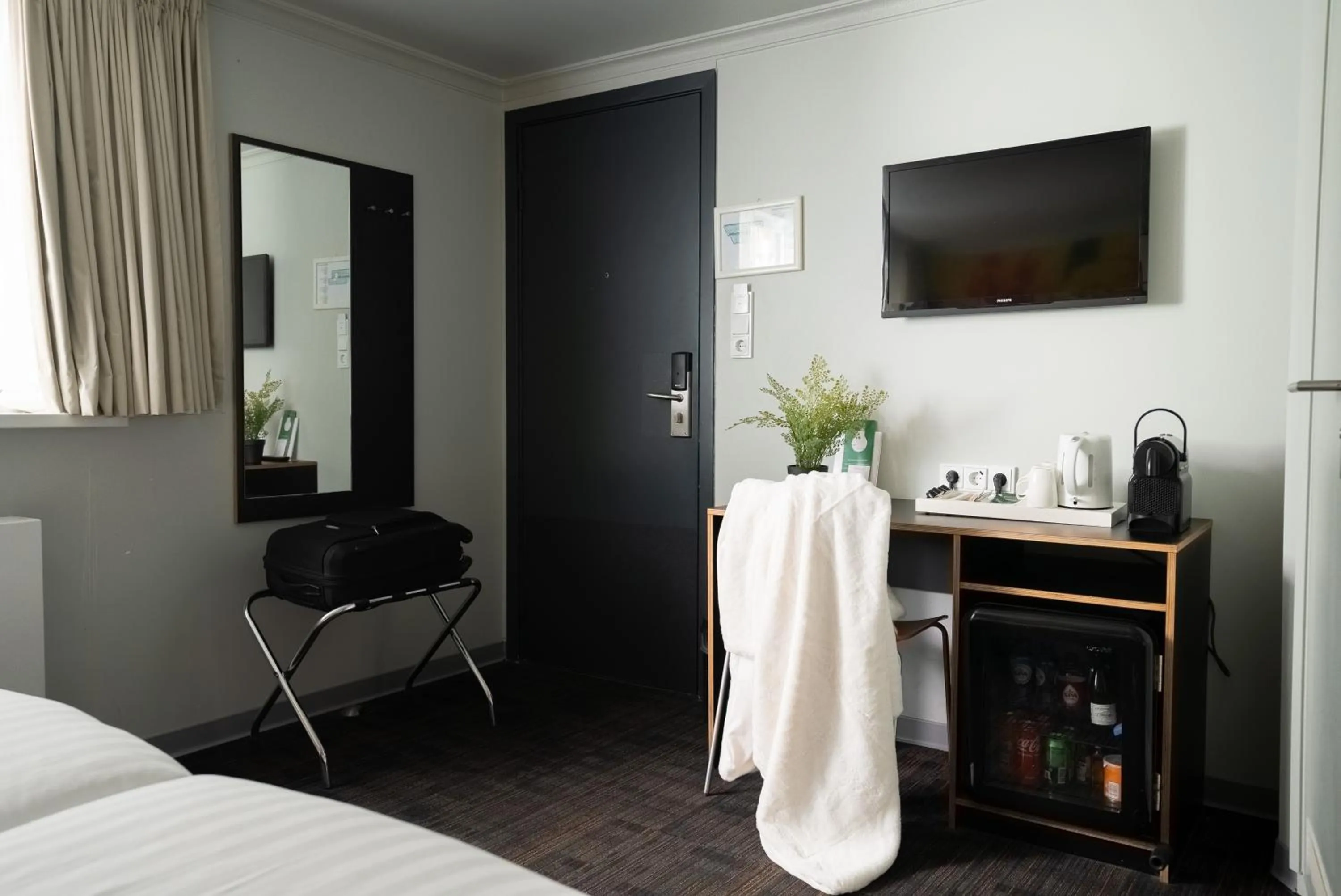 Bed in Multatuli Hotel