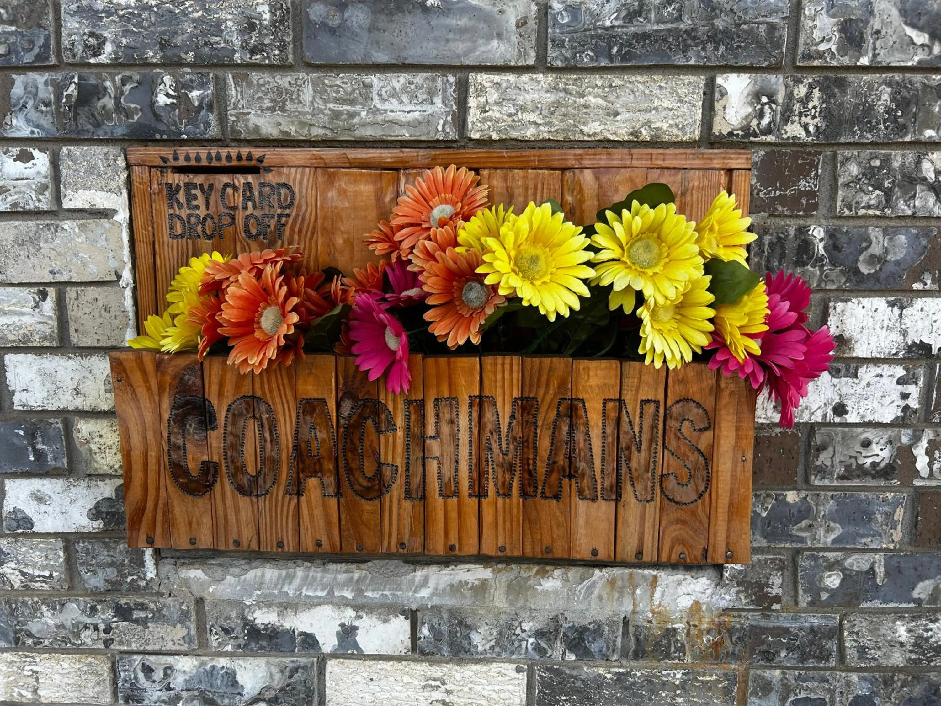 Property logo or sign in Coachman's Inn & Suites