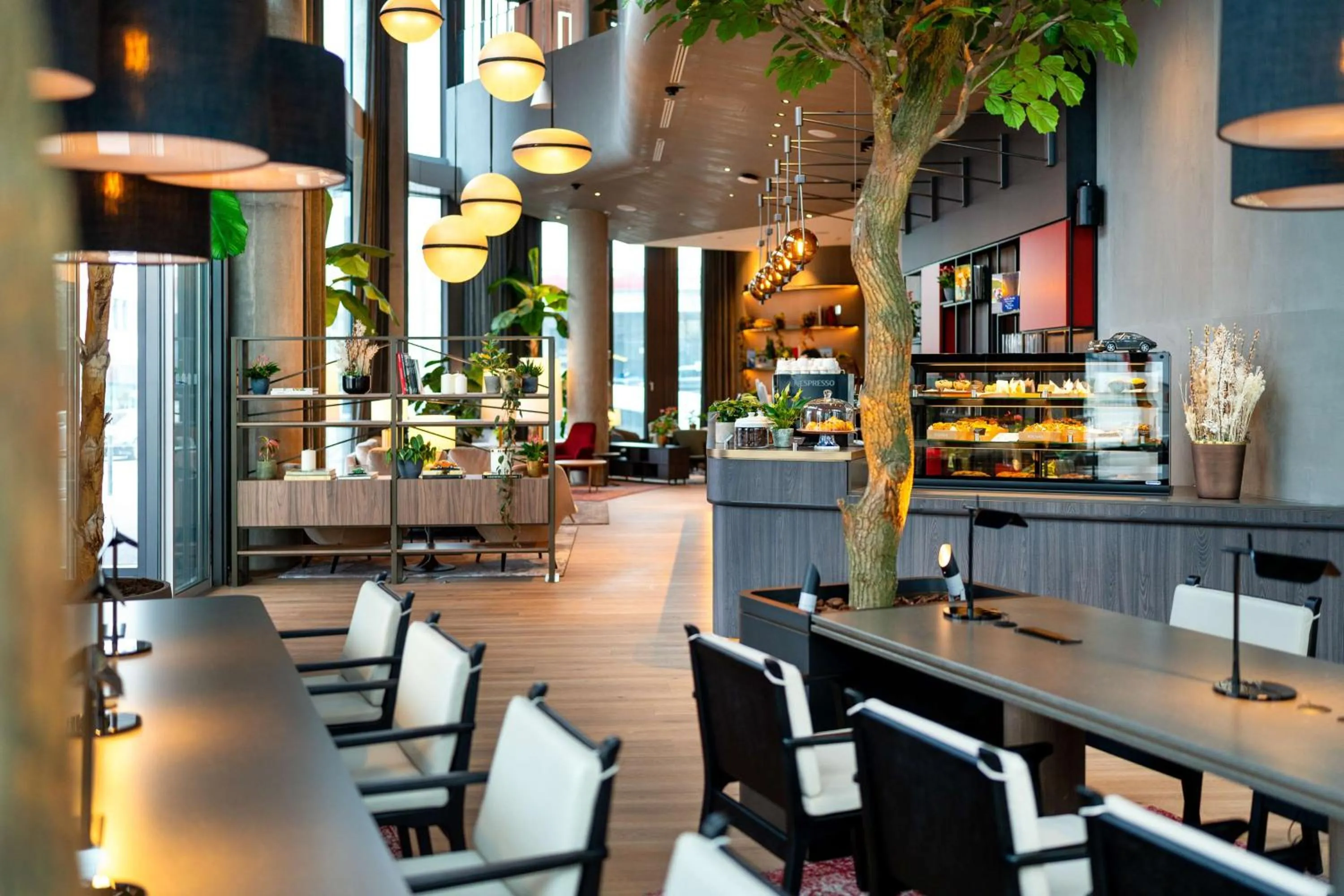 Lobby or reception in Radisson Blu Hotel at Porsche Design Tower Stuttgart