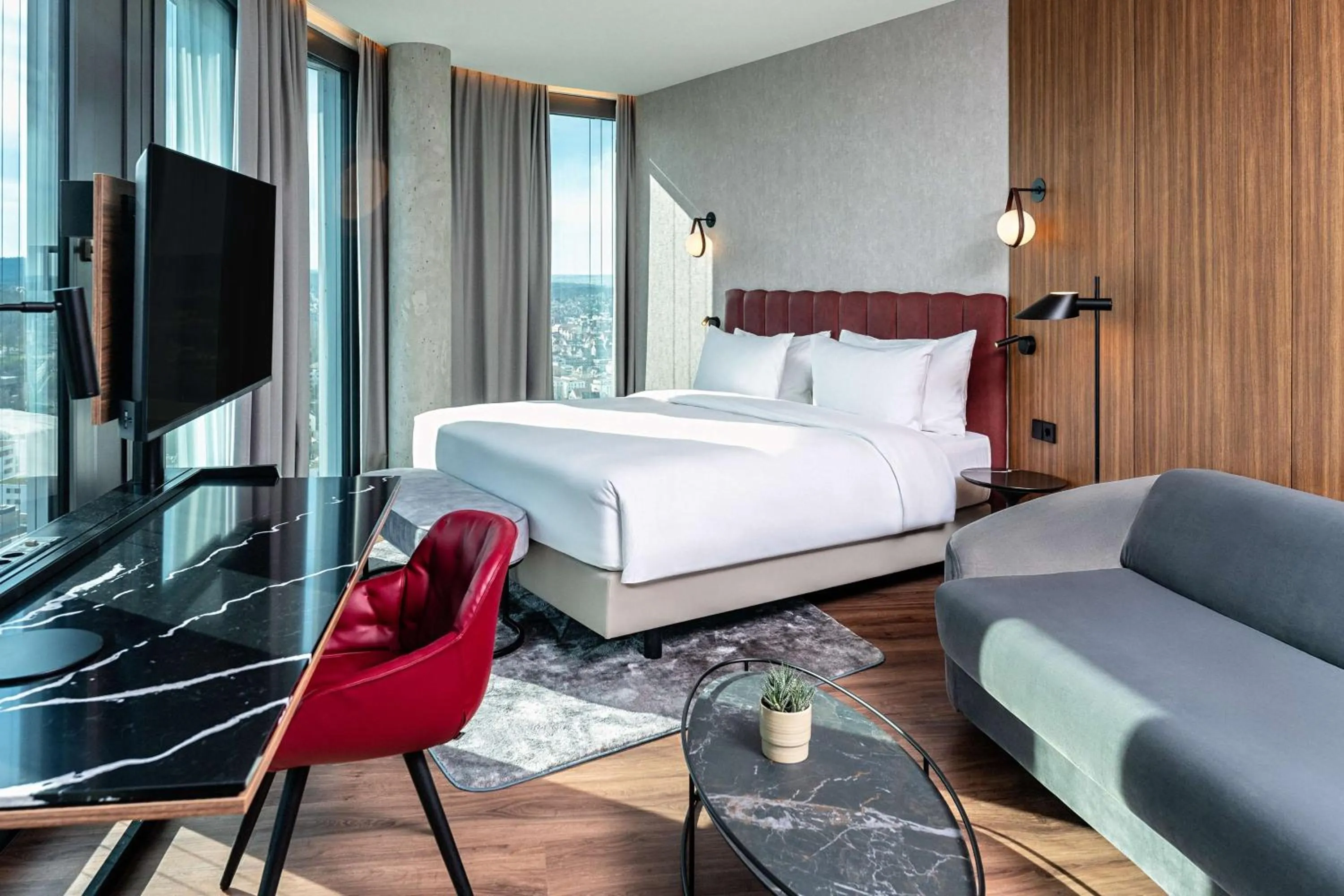 Photo of the whole room, Bed in Radisson Blu Hotel at Porsche Design Tower Stuttgart
