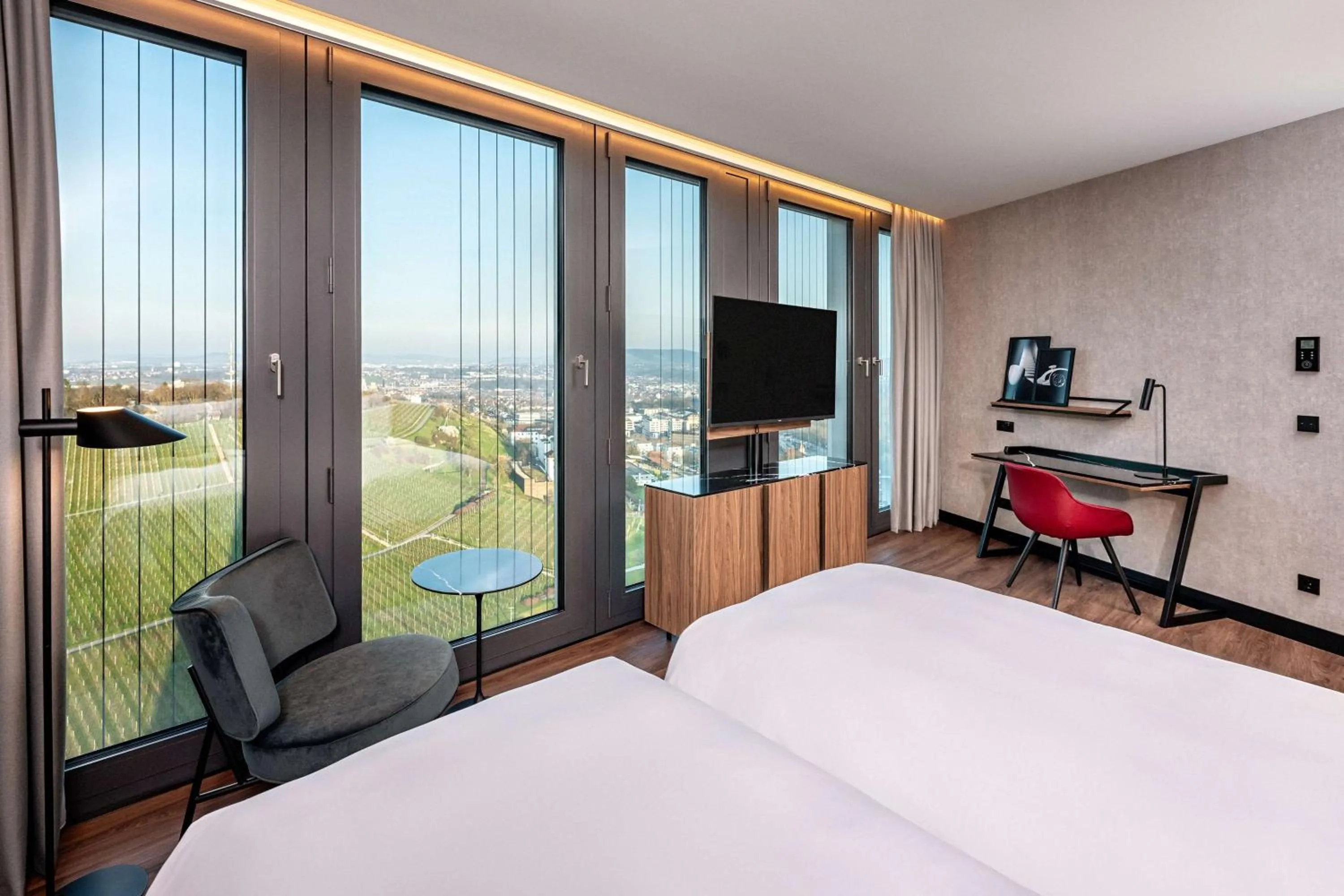 Bedroom, Bed in Radisson Blu Hotel at Porsche Design Tower Stuttgart