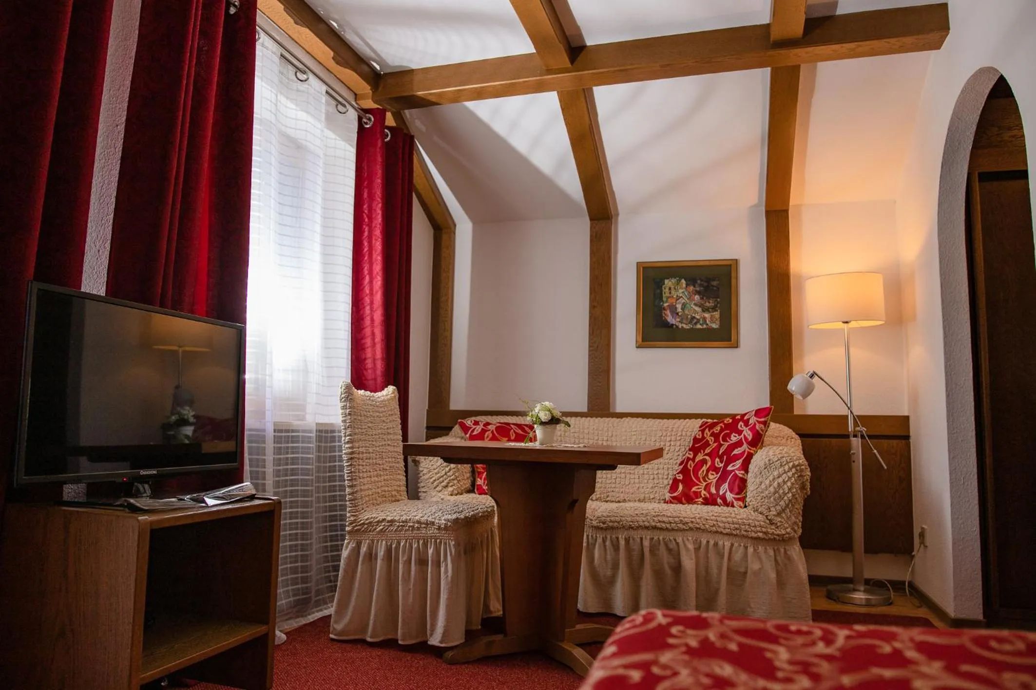 Seating area, Bed in Hotel St. Georg