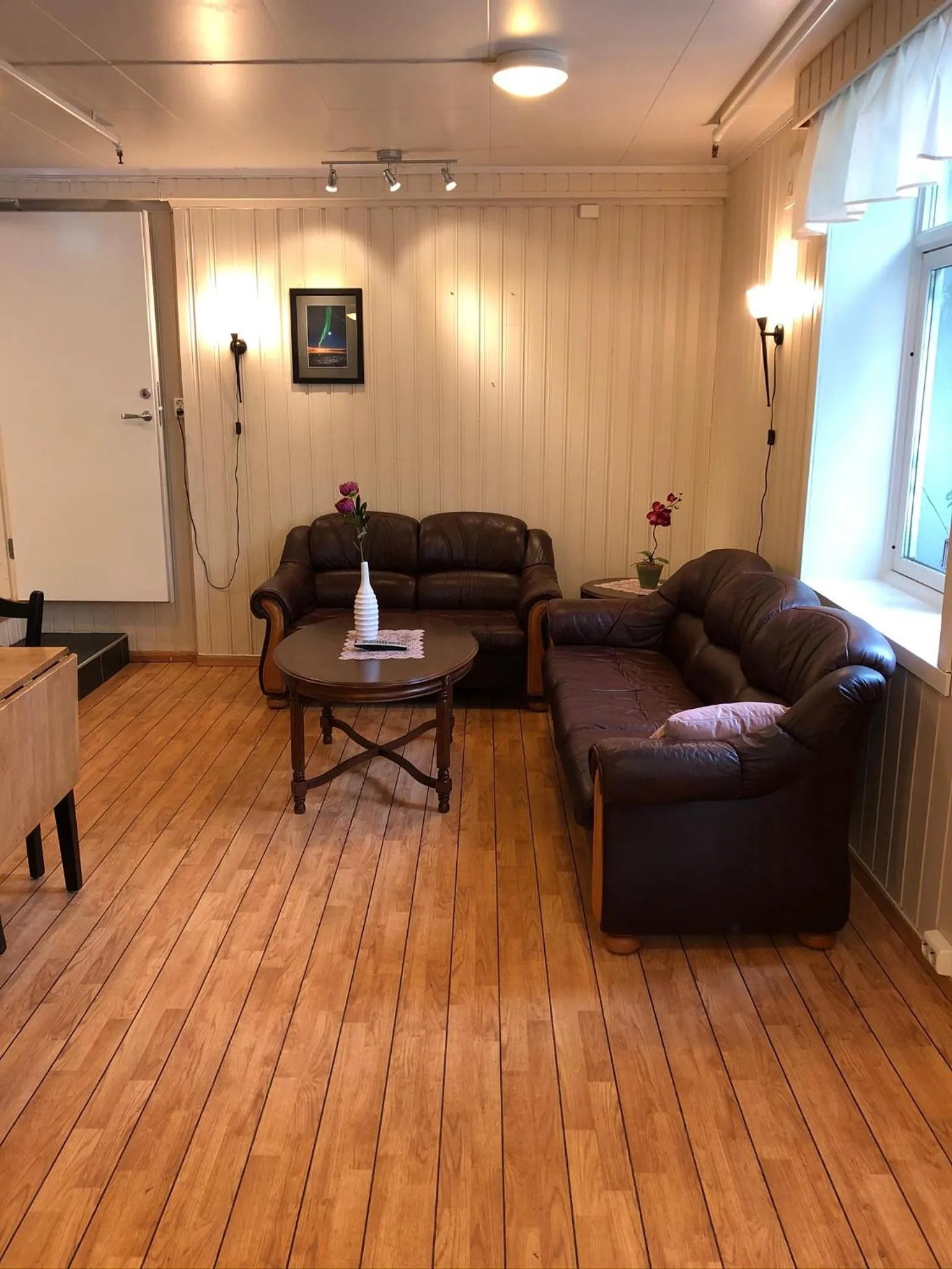 Communal lounge/ TV room in Ami Hotel