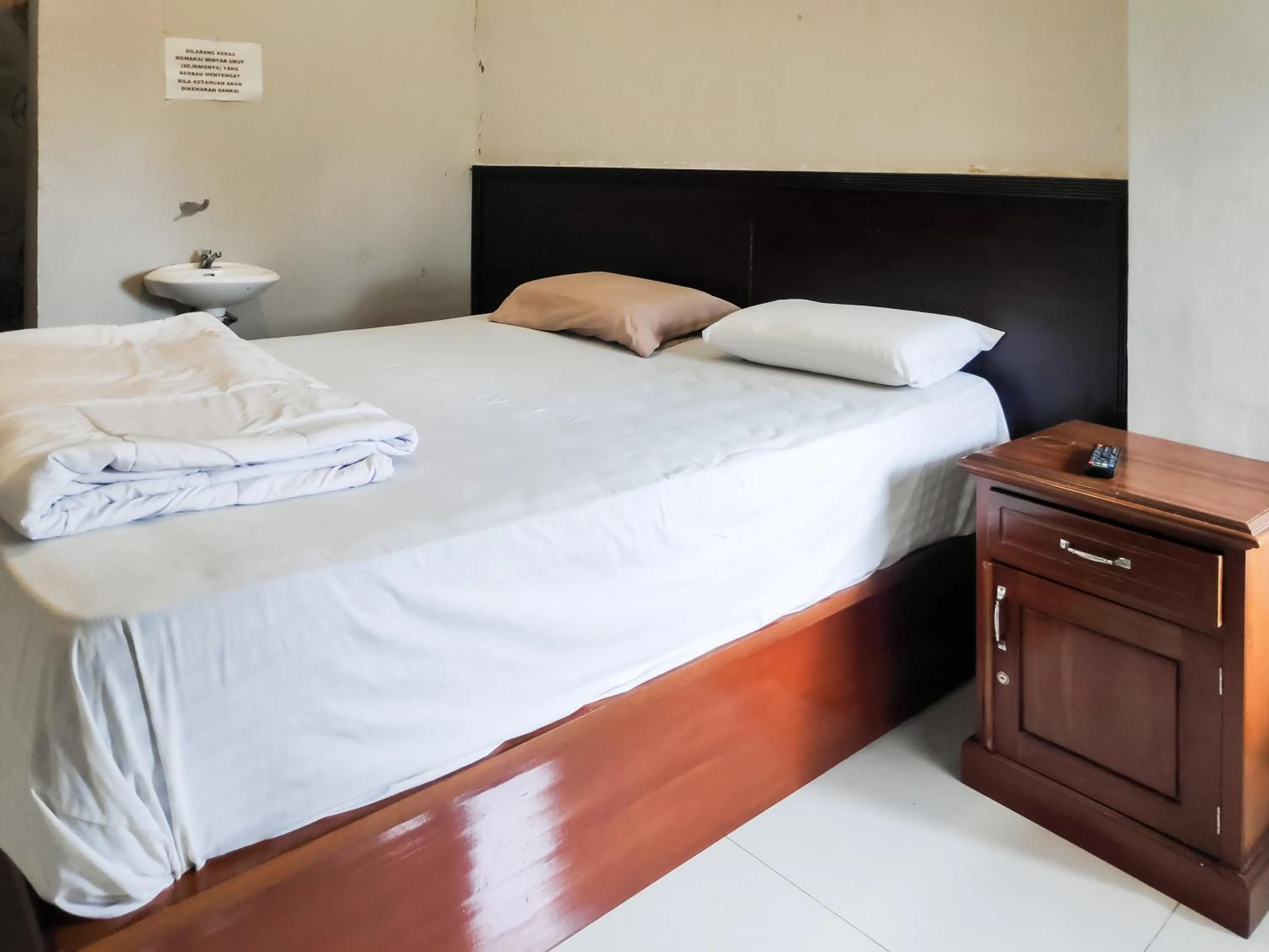 Bed in RedDoorz Syariah near Terminal Terpadu Langsa