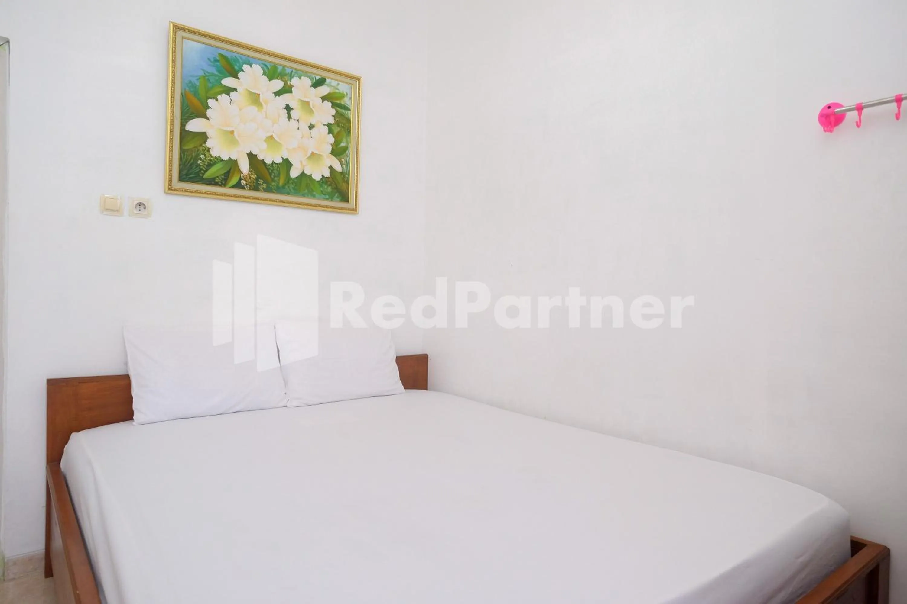 Bed in Wisma Giri Mulyo B near Grojogan Sewu Mitra RedDoorz