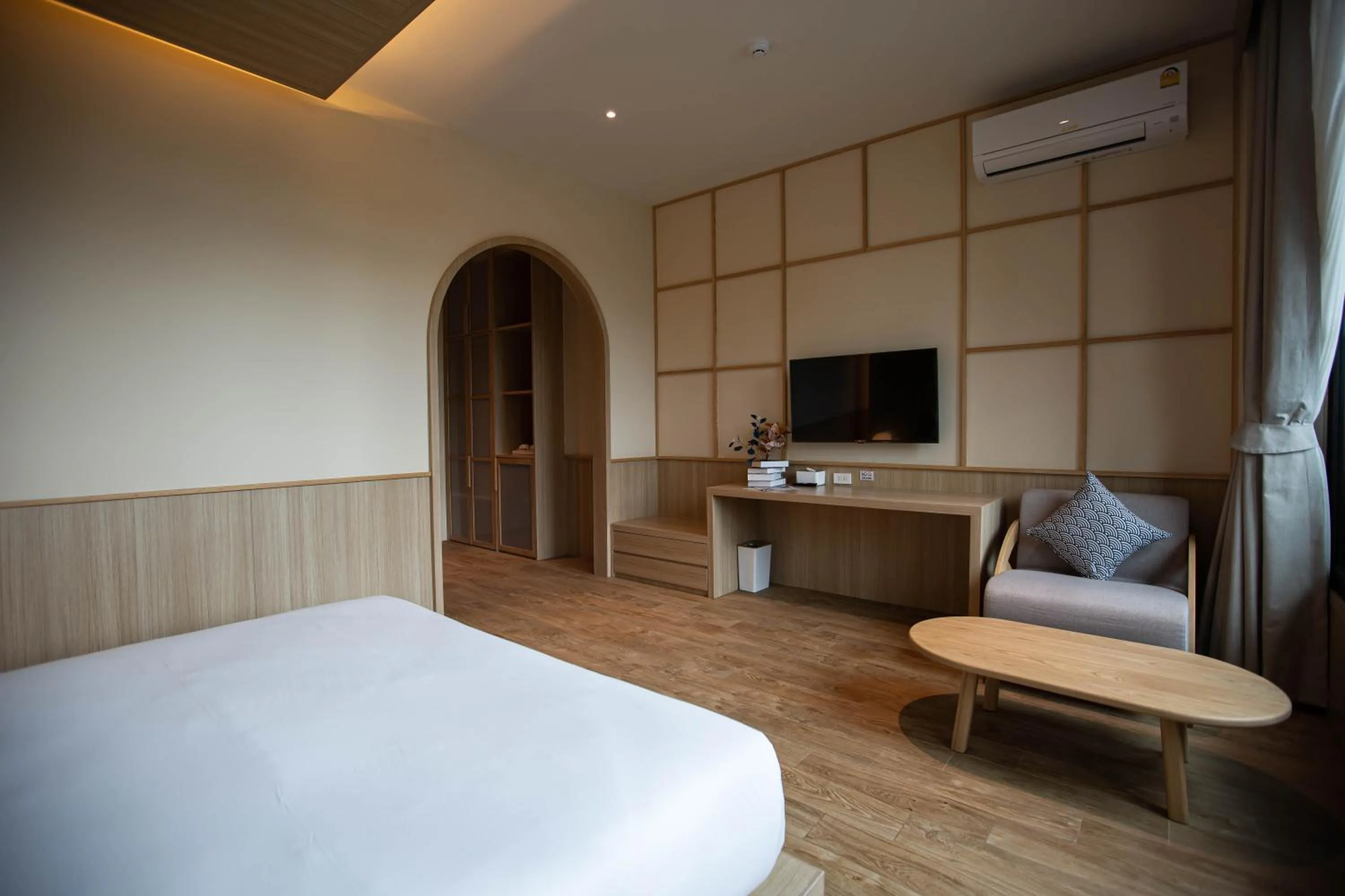 Seating area, Bed in The Arch Phuket Hotel