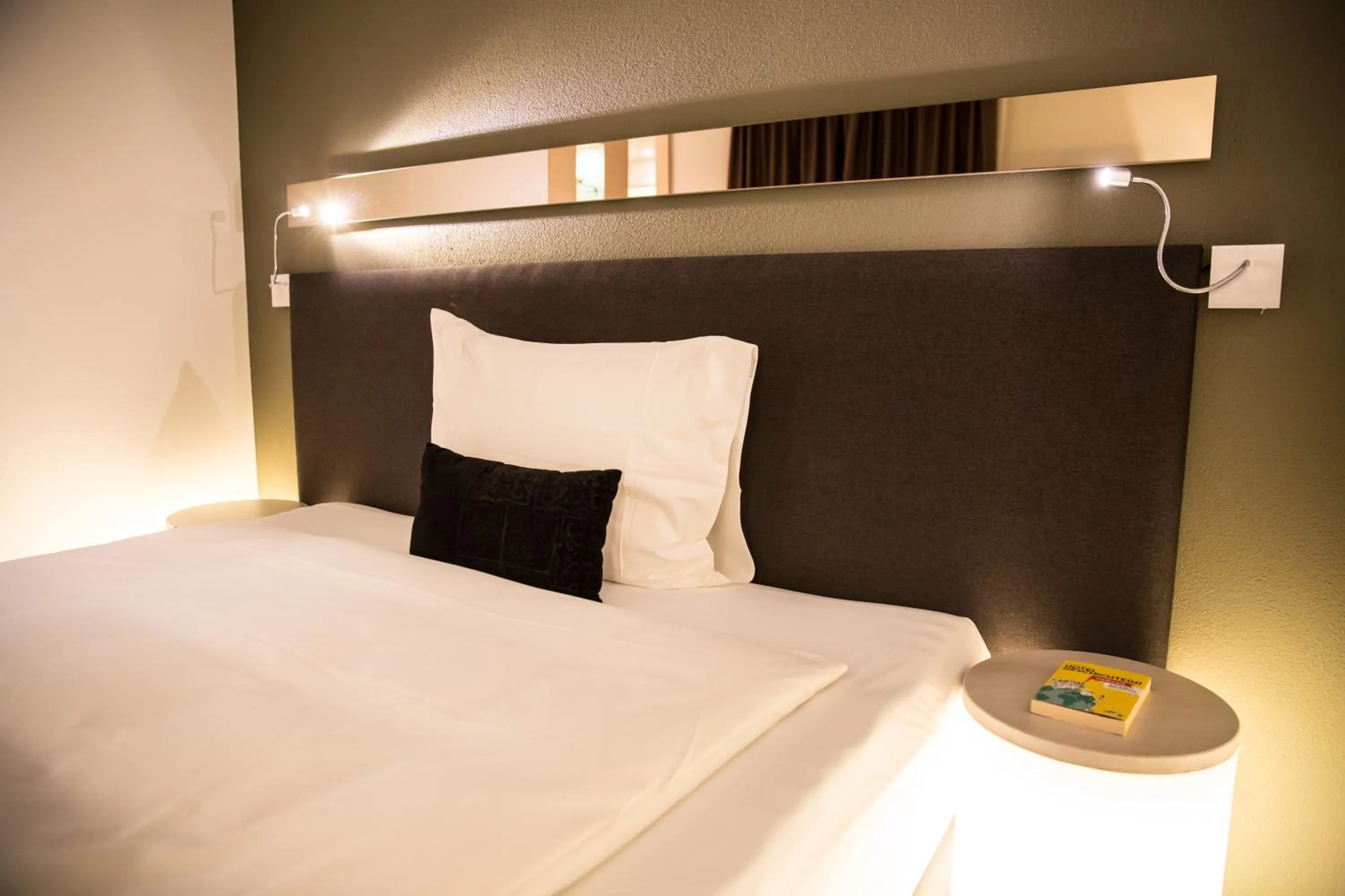 Bed in JUCKERs Boutique-Hotel