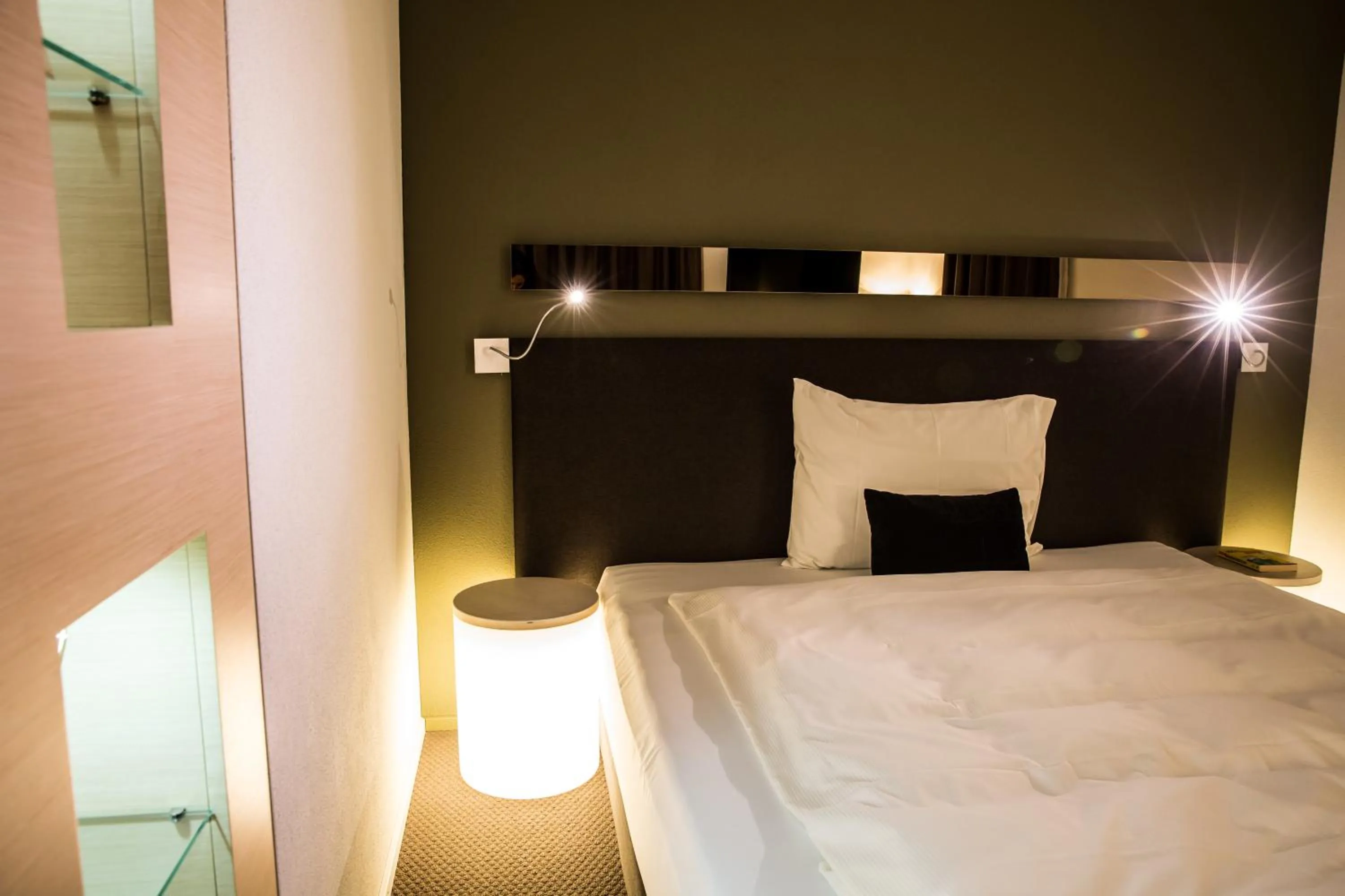 Bed in JUCKERs Boutique-Hotel