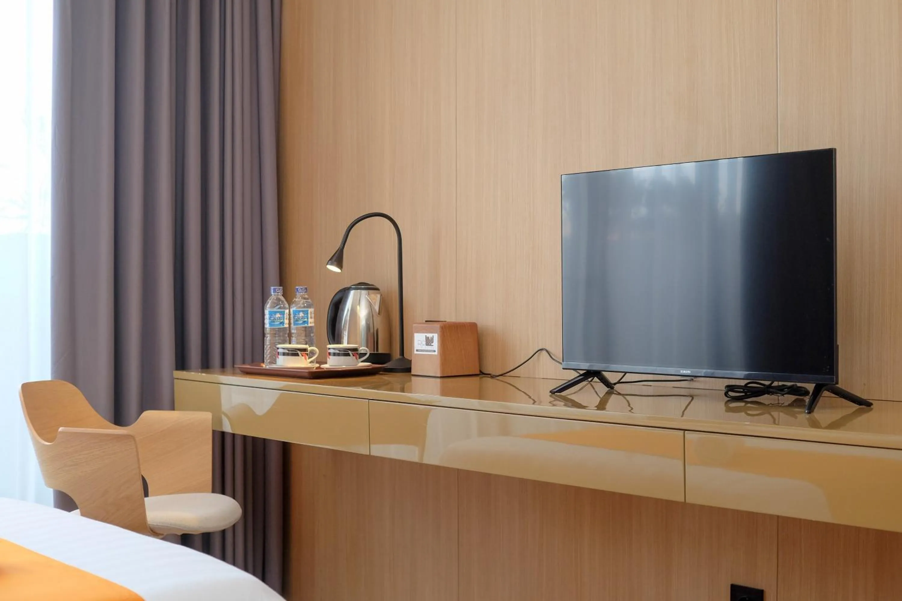 Bed in Sans Hotel RG Living Jogja by RedDoorz