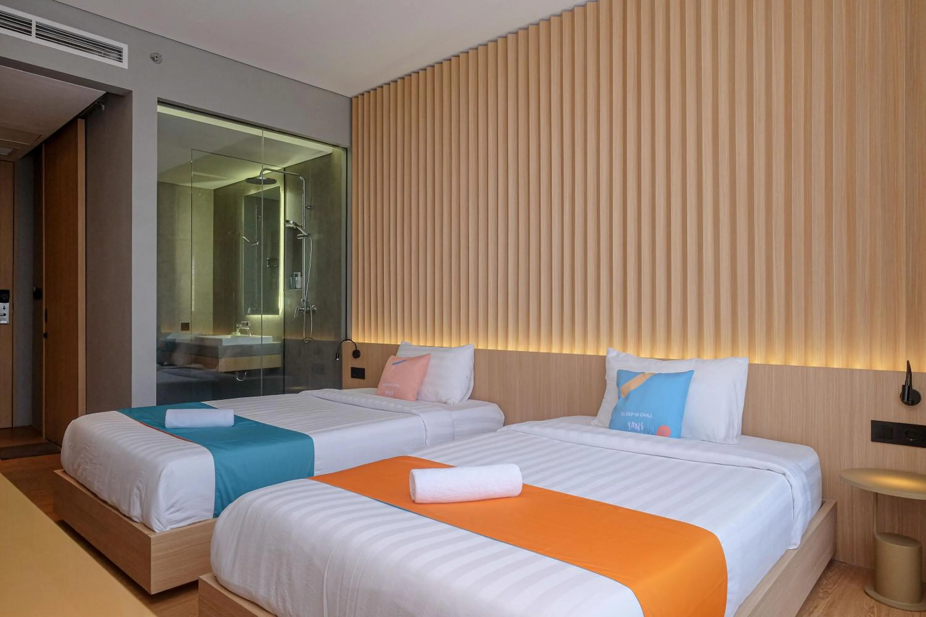 Bed in Sans Hotel RG Living Jogja by RedDoorz