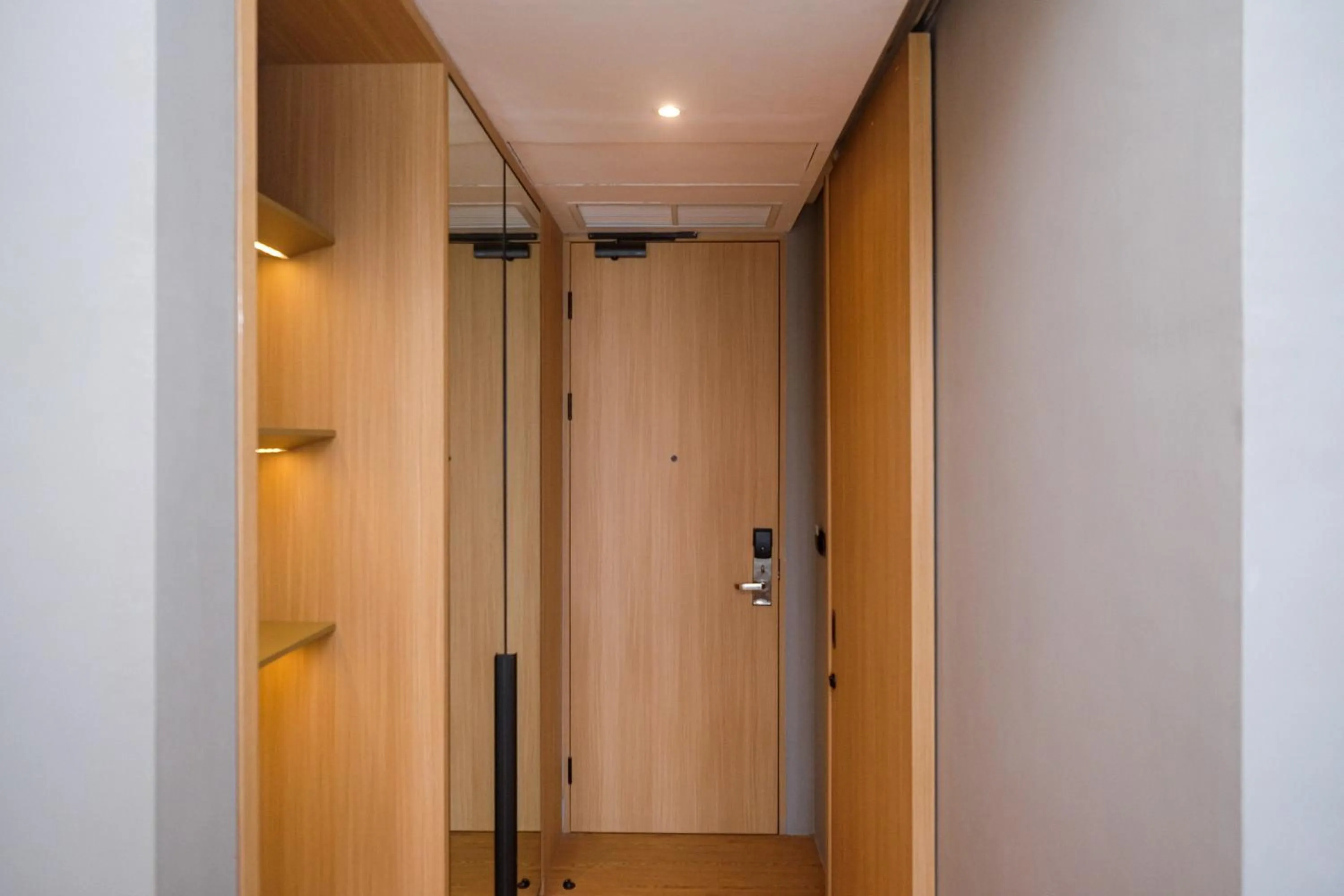 wardrobe in Sans Hotel RG Living Jogja by RedDoorz