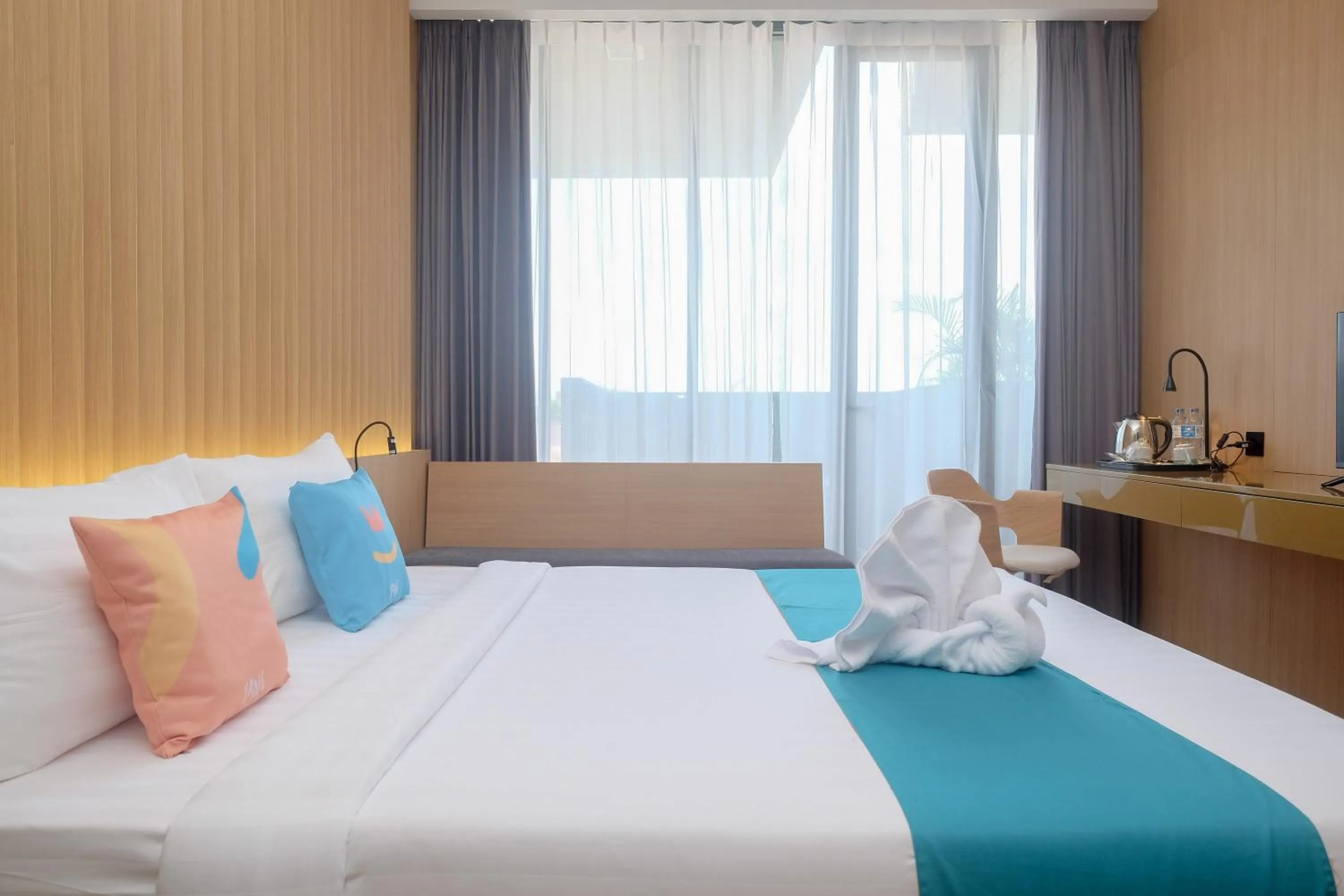 Bed in Sans Hotel RG Living Jogja by RedDoorz