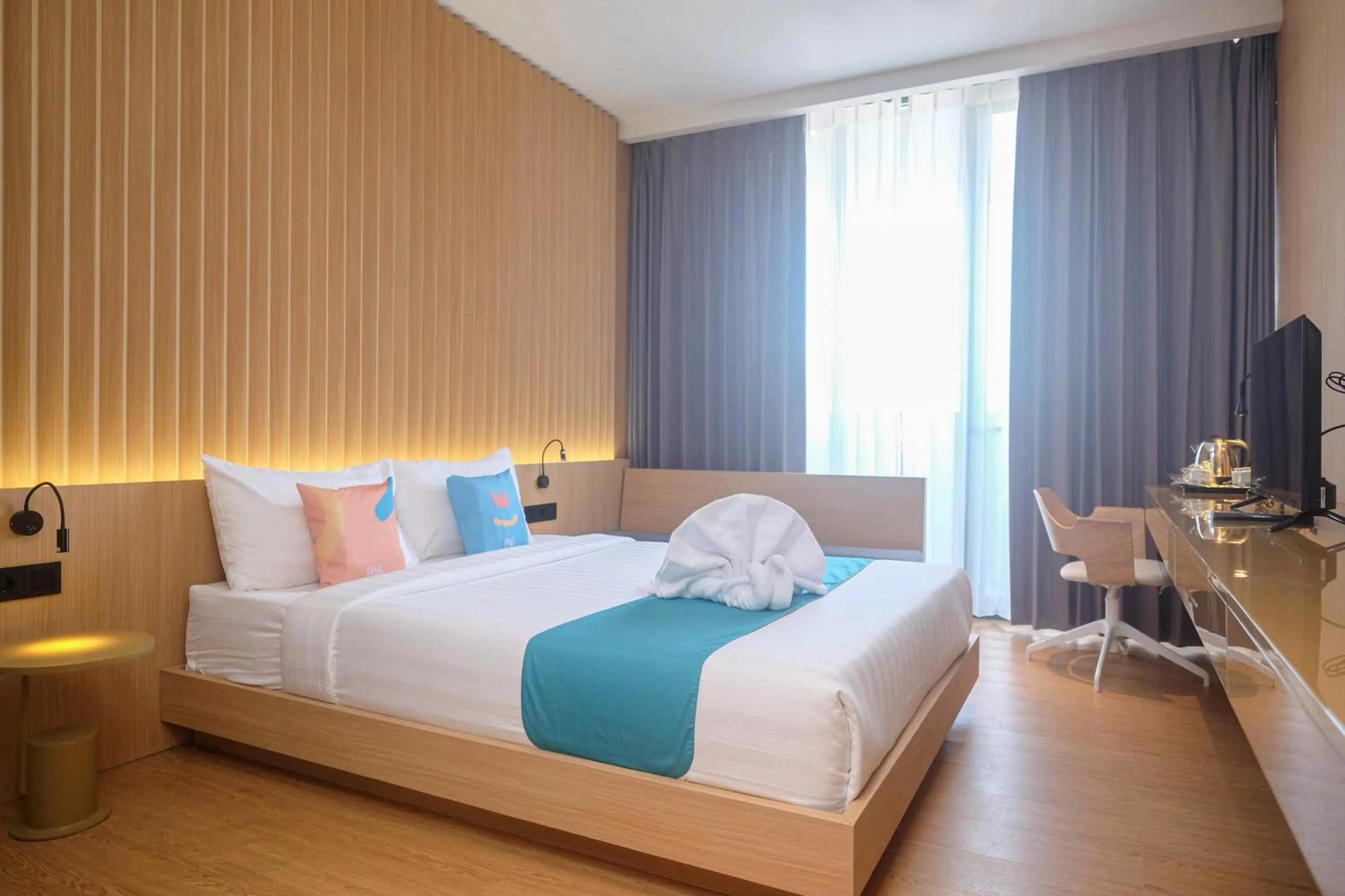 Bed in Sans Hotel RG Living Jogja by RedDoorz