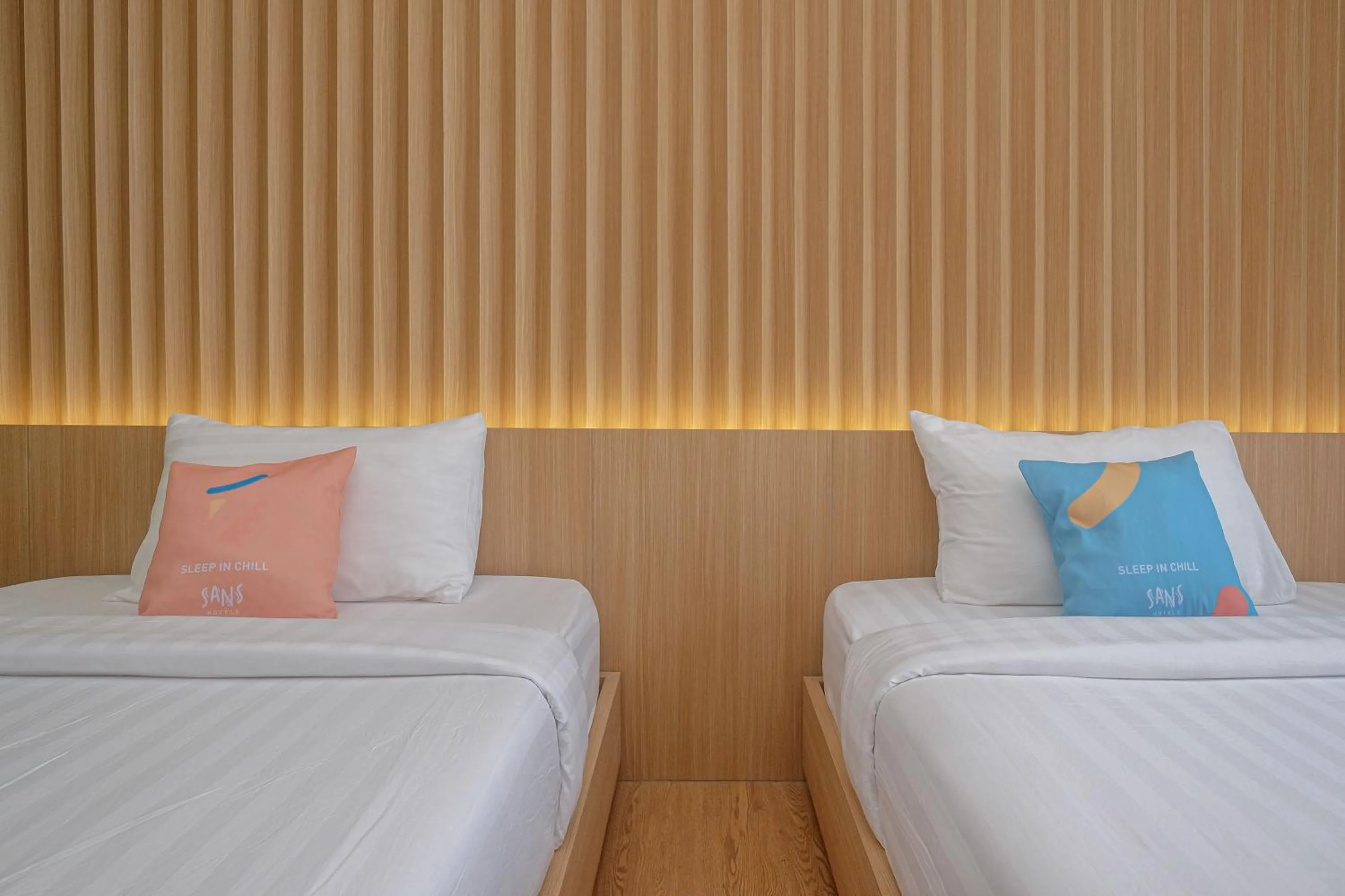 Bed in Sans Hotel RG Living Jogja by RedDoorz