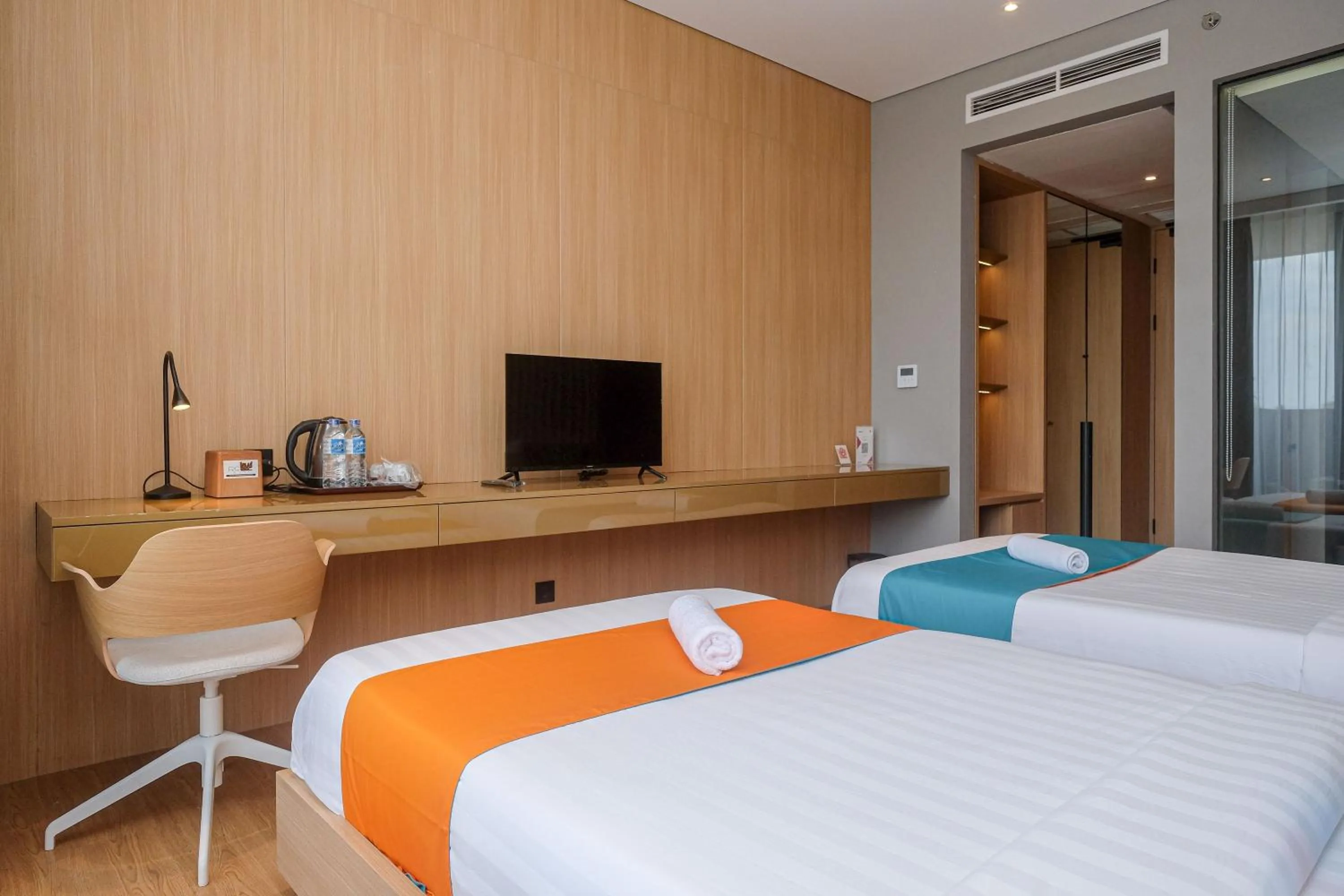 Bed in Sans Hotel RG Living Jogja by RedDoorz