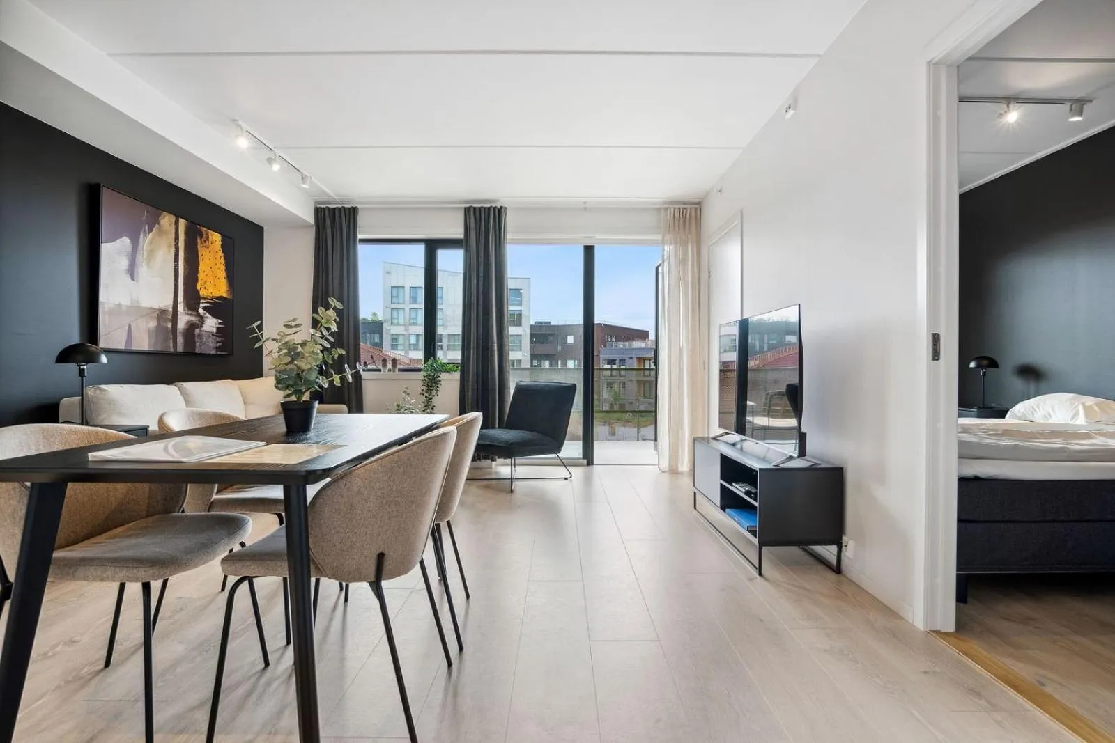 Living room, Bed in TotalApartments Vervet Gjøa