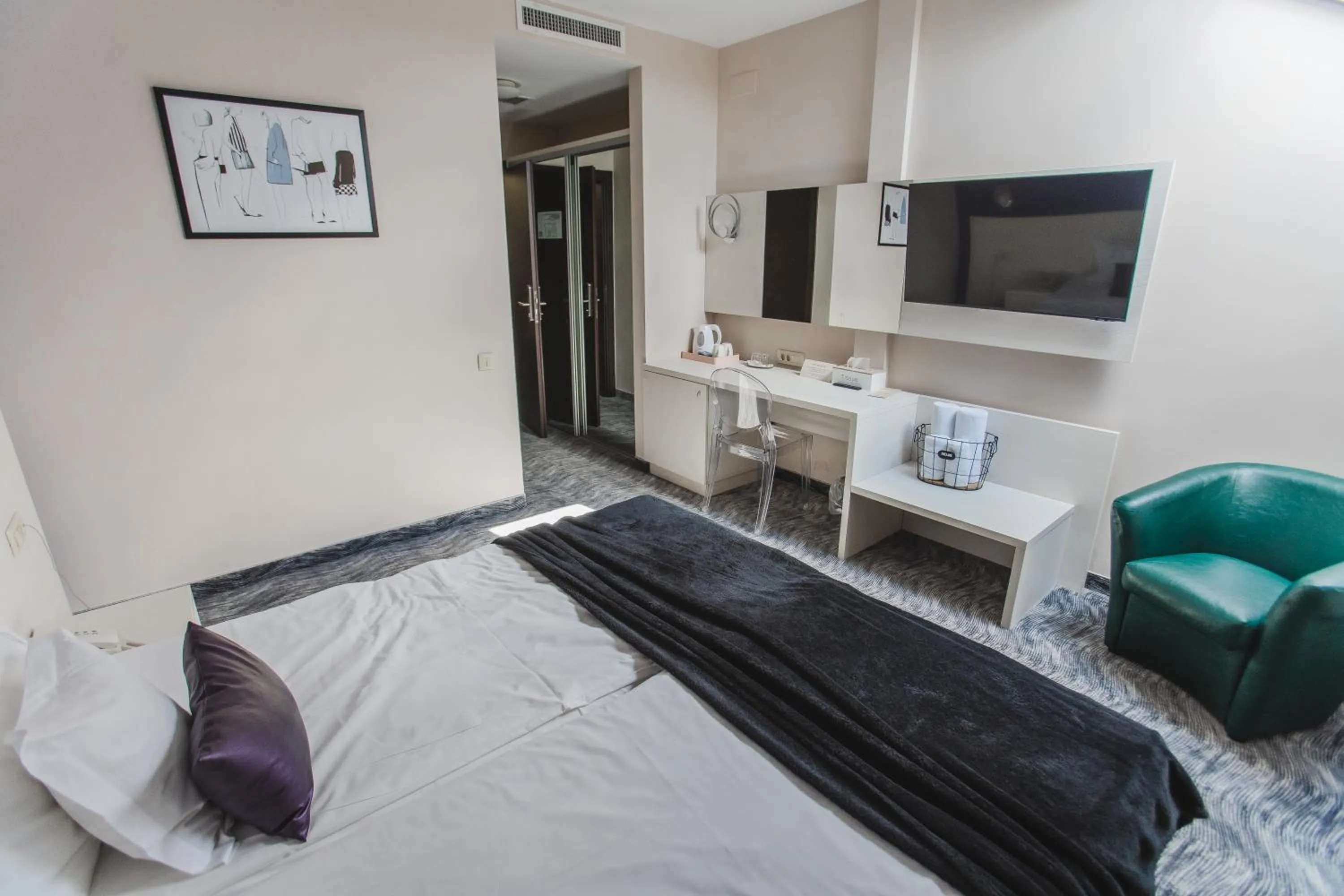 Bed in Caro Boutique Hotel