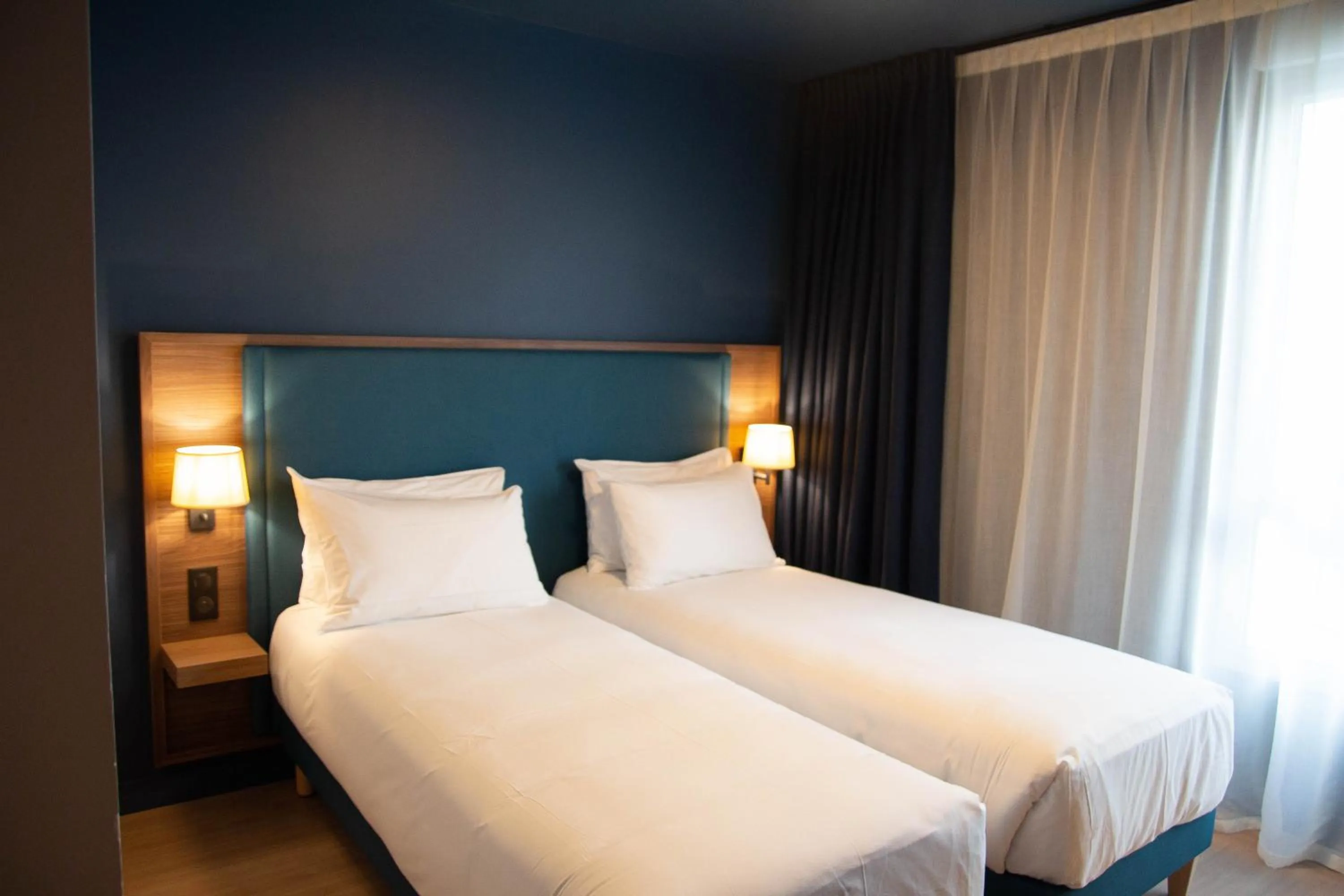 Bed in Hôtel de la Cité