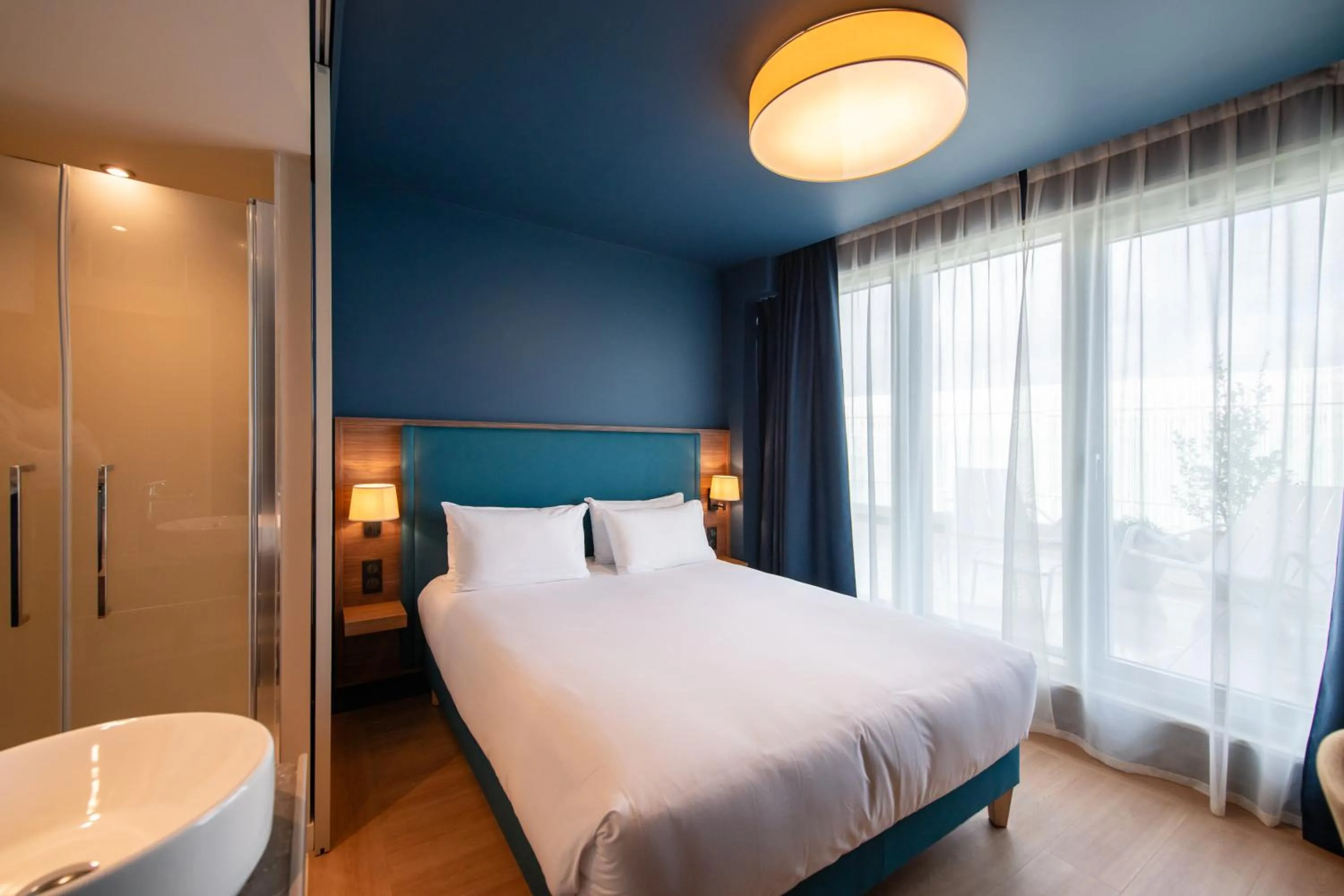 Bed in Hôtel de la Cité