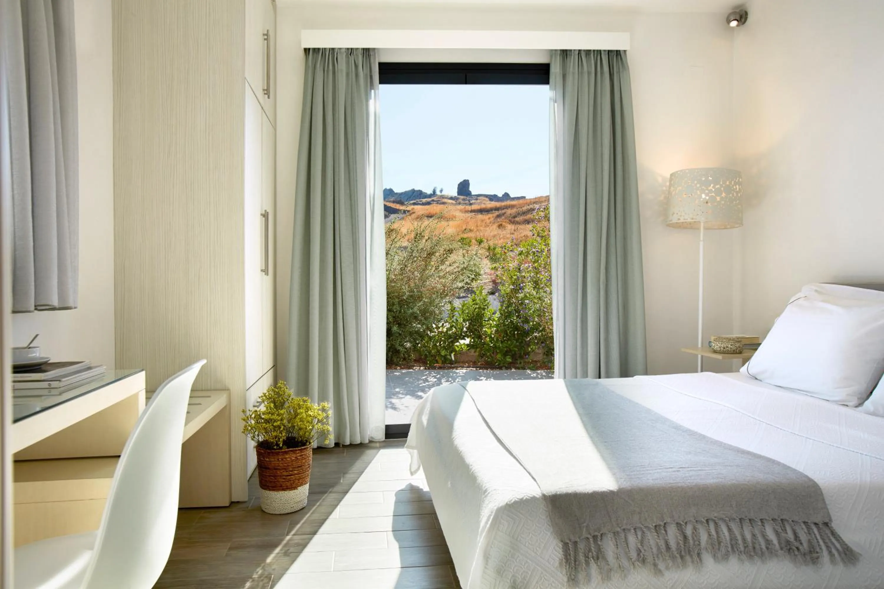 Bed in Eleia Seafront Rooms & Villas