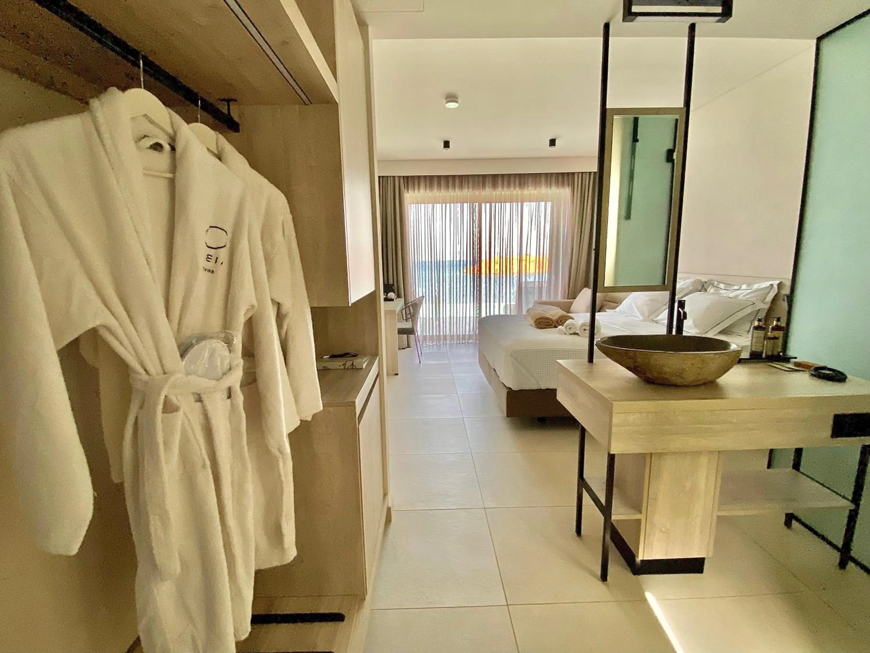 Bed in Eleia Seafront Rooms & Villas