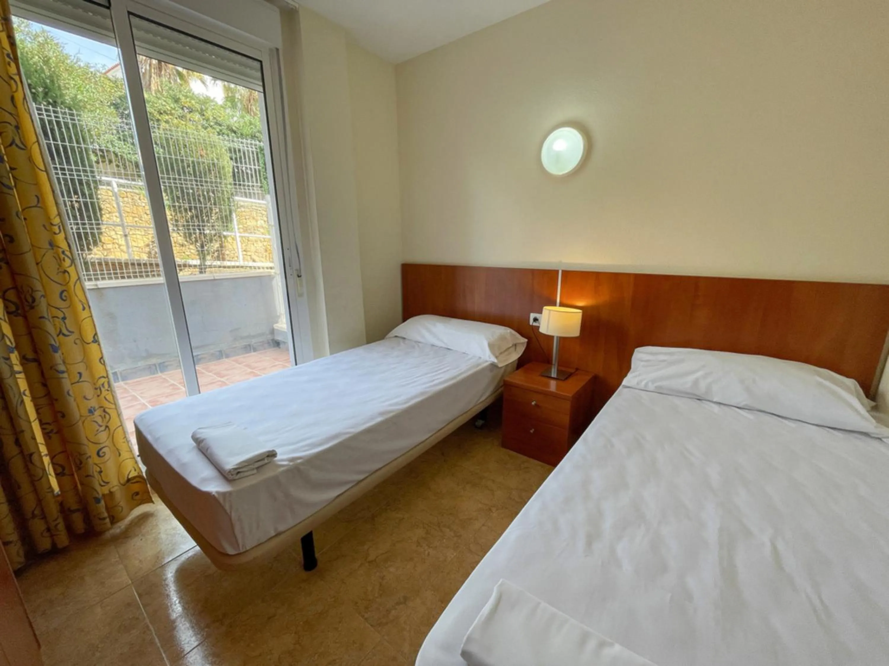 Bed in Apartamentos Marcomar 3000