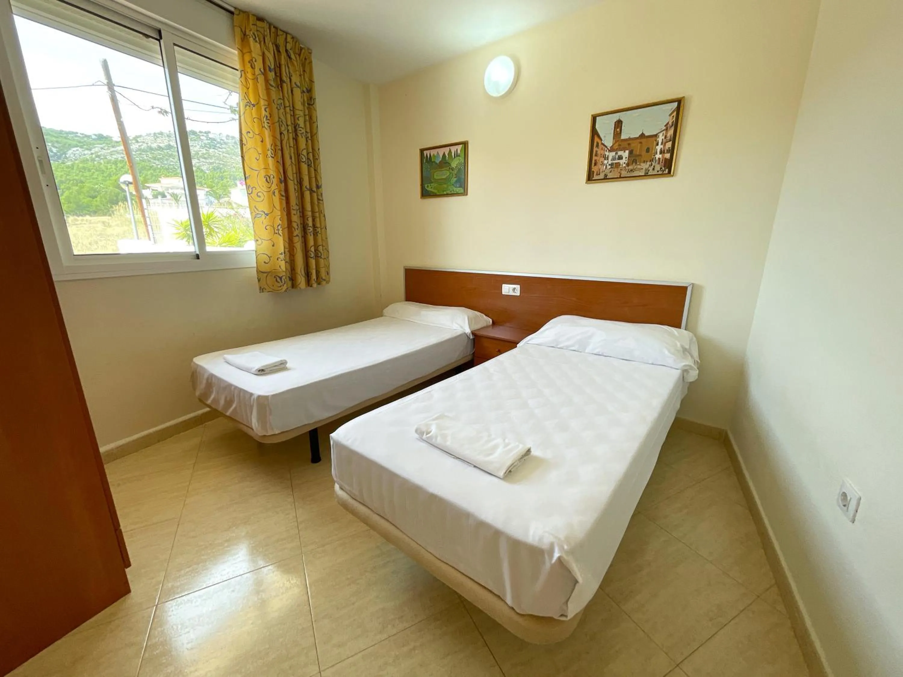 Bed in Apartamentos Marcomar 3000