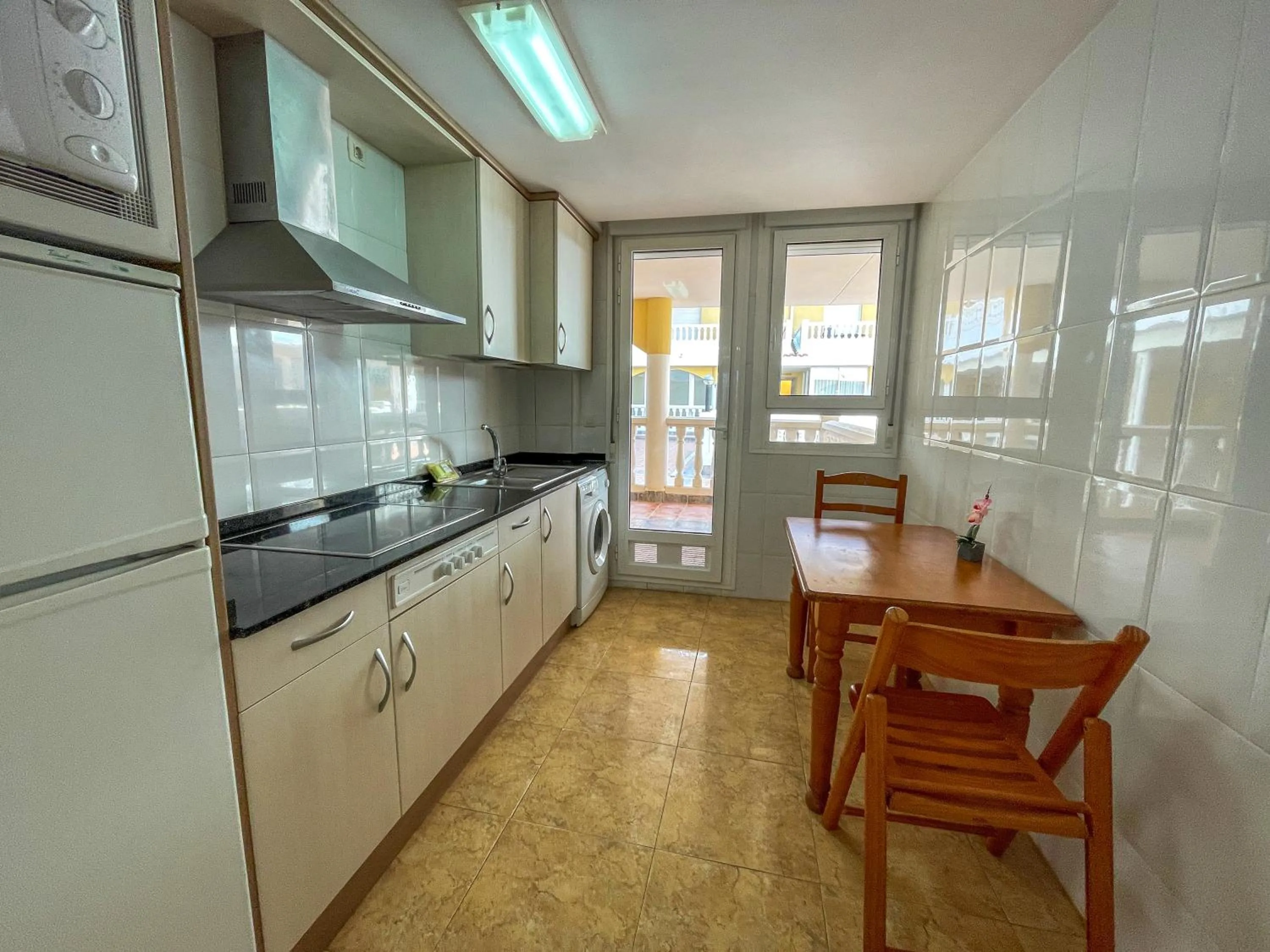 Kitchen or kitchenette in Apartamentos Marcomar 3000