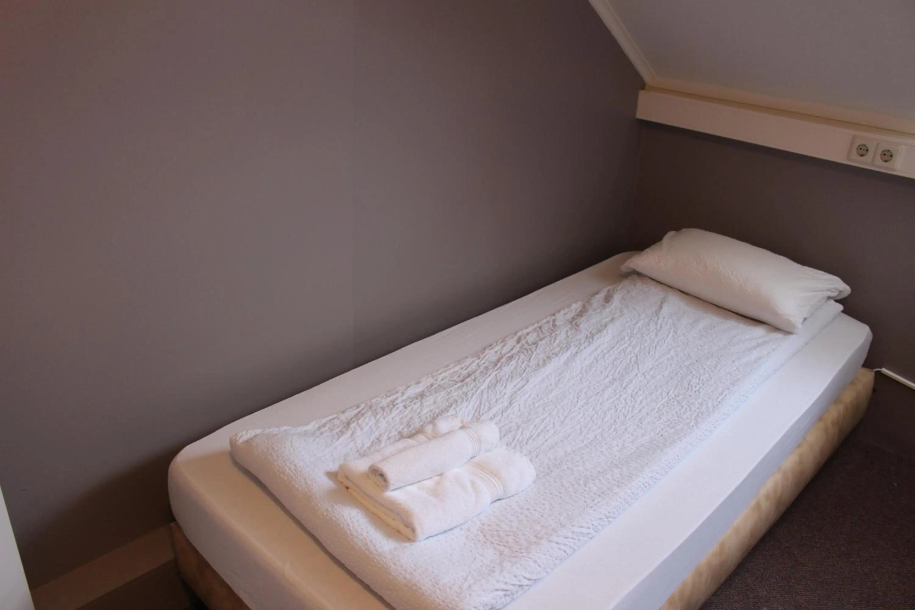 Bed in Welcome Riverside Guesthouse