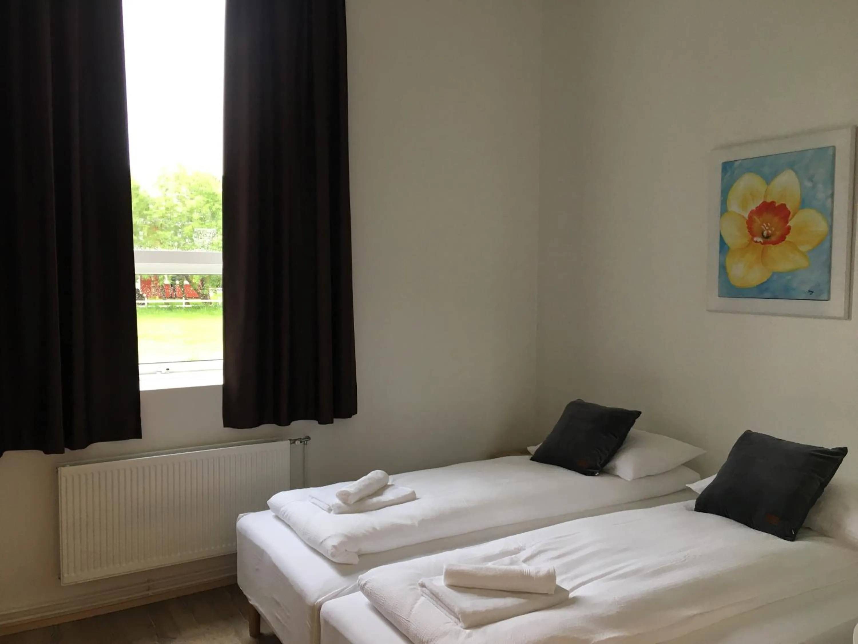 Bed in Welcome Riverside Guesthouse