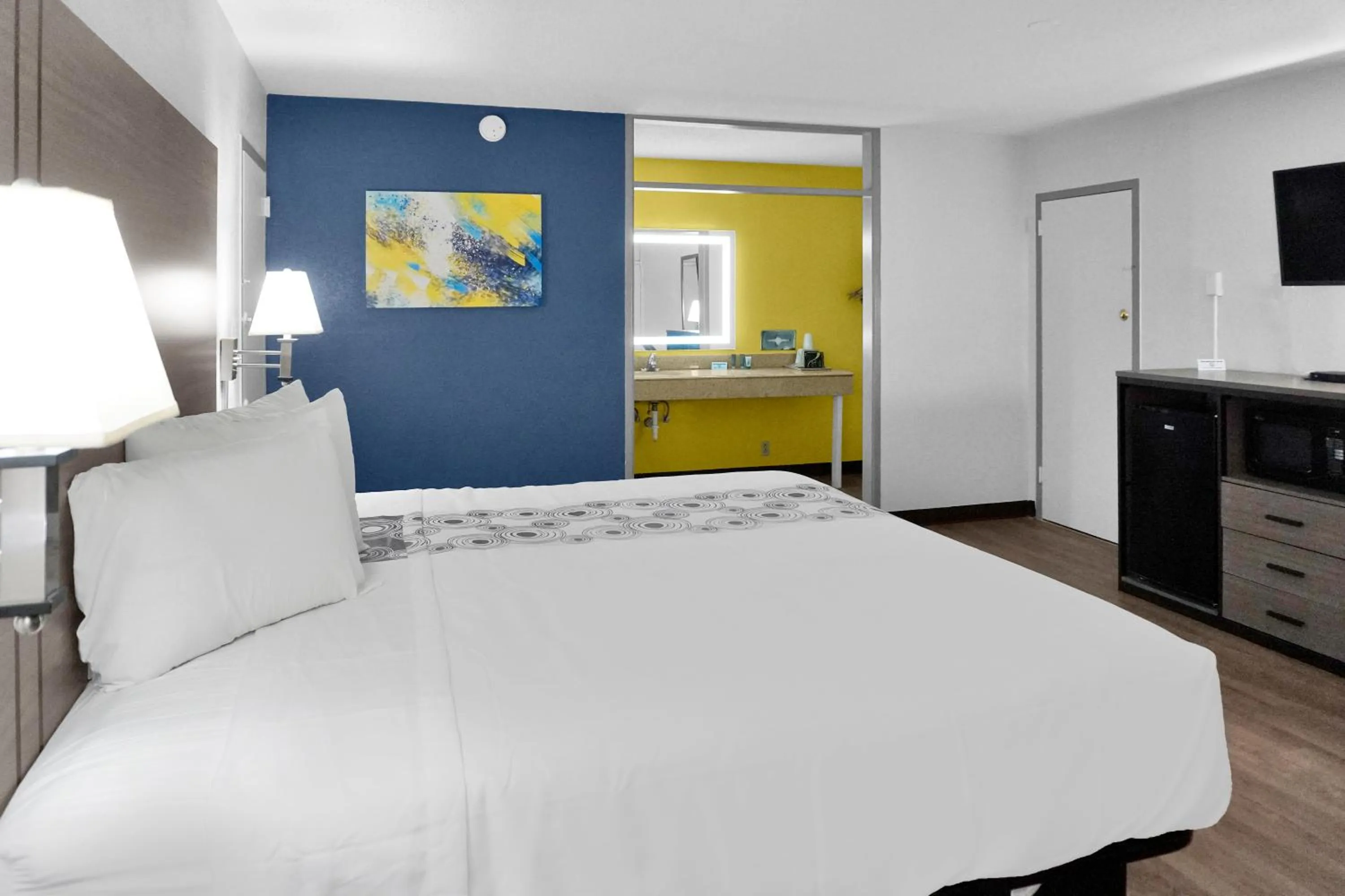 Bed in Hometown Inn + Kitchen