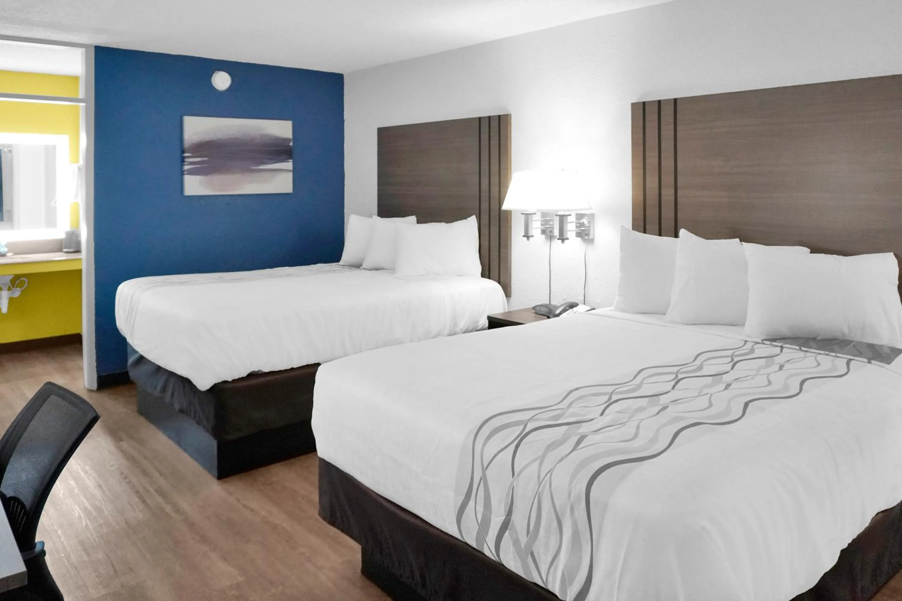 Bed in Hometown Inn + Kitchen