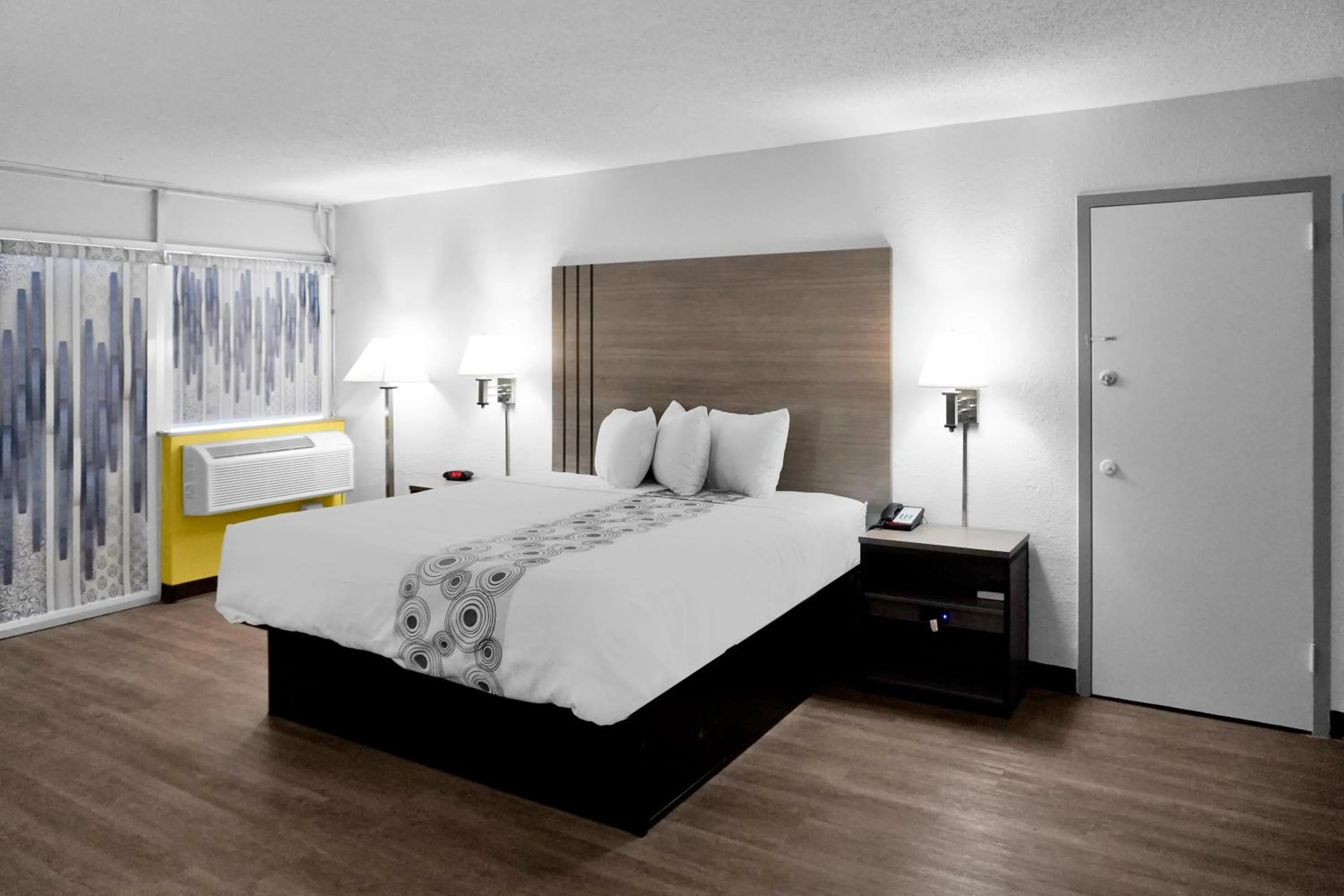 Bed in Hometown Inn + Kitchen