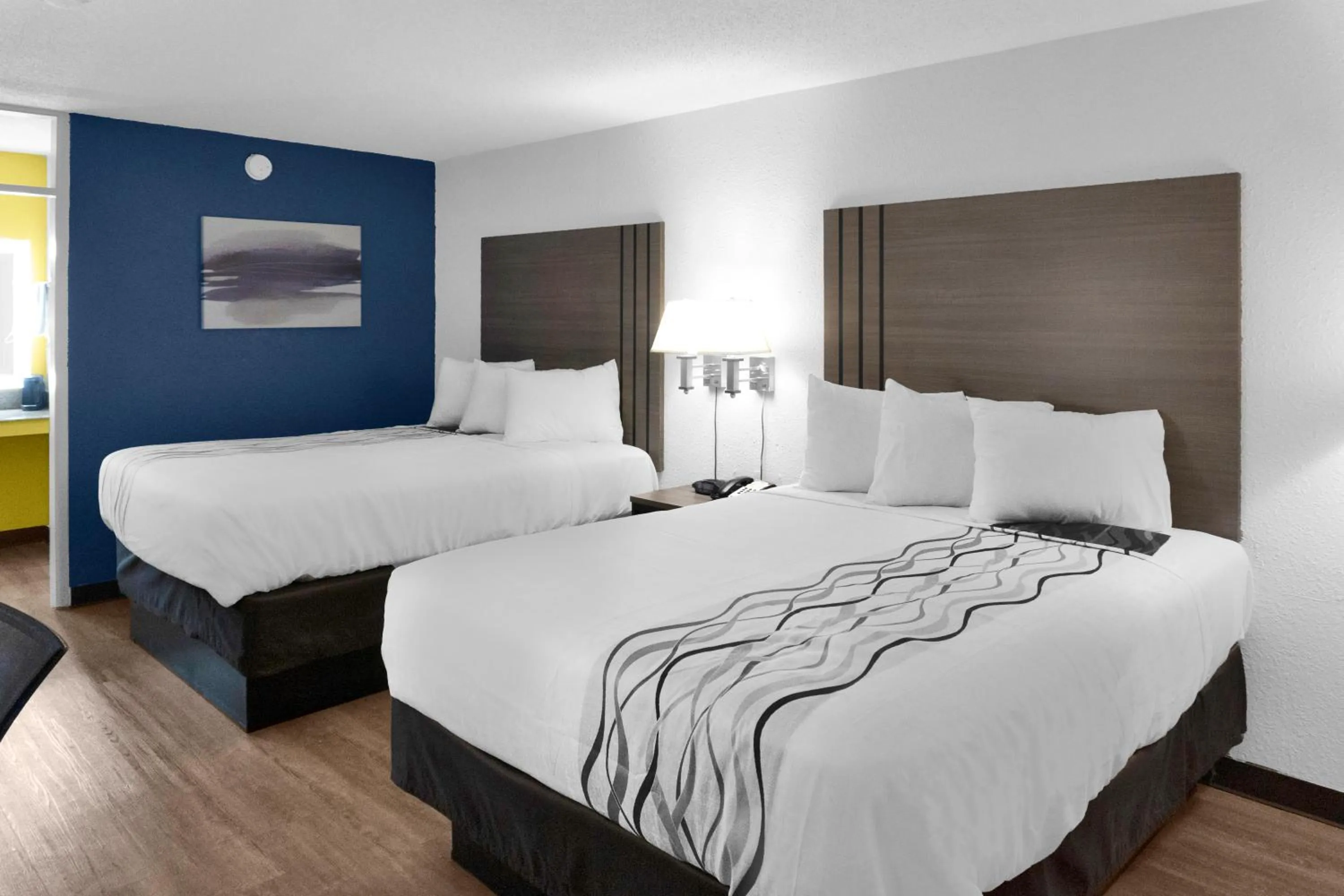 Bed in Hometown Inn + Kitchen